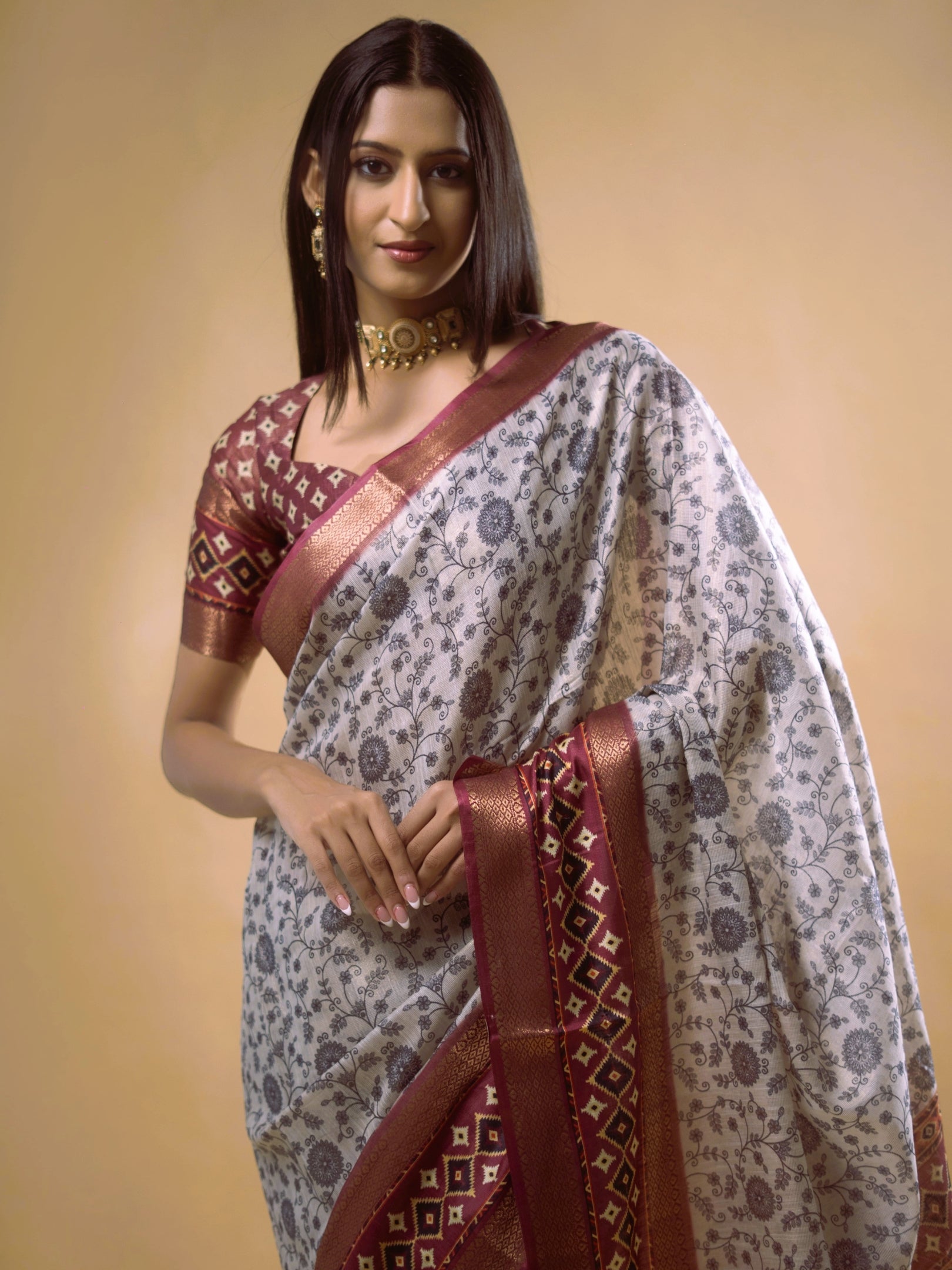 Cream Floral Saree with Maroon Geometric Zari Border and Printed Blouse