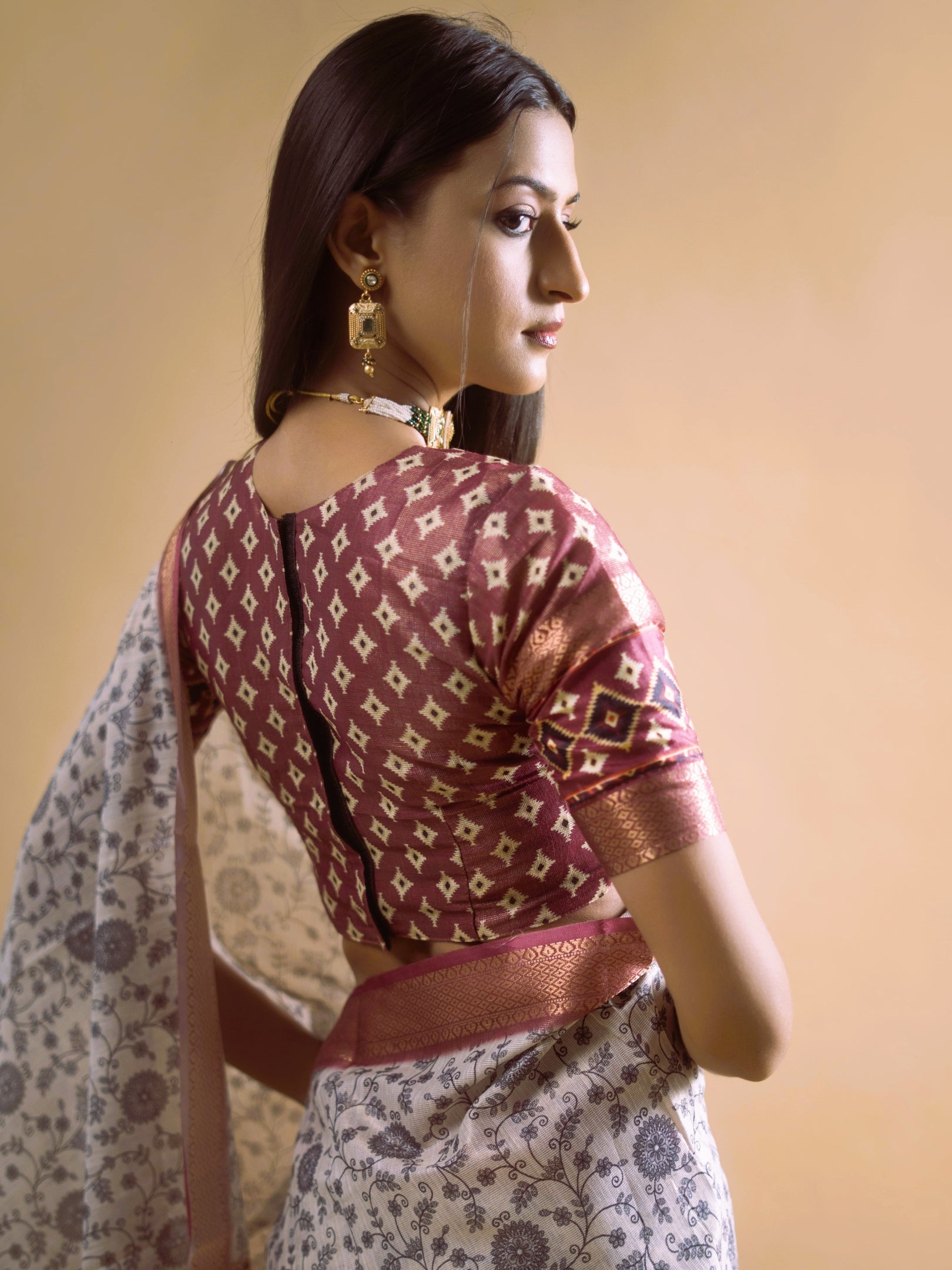 Cream Floral Saree with Maroon Geometric Zari Border and Printed Blouse