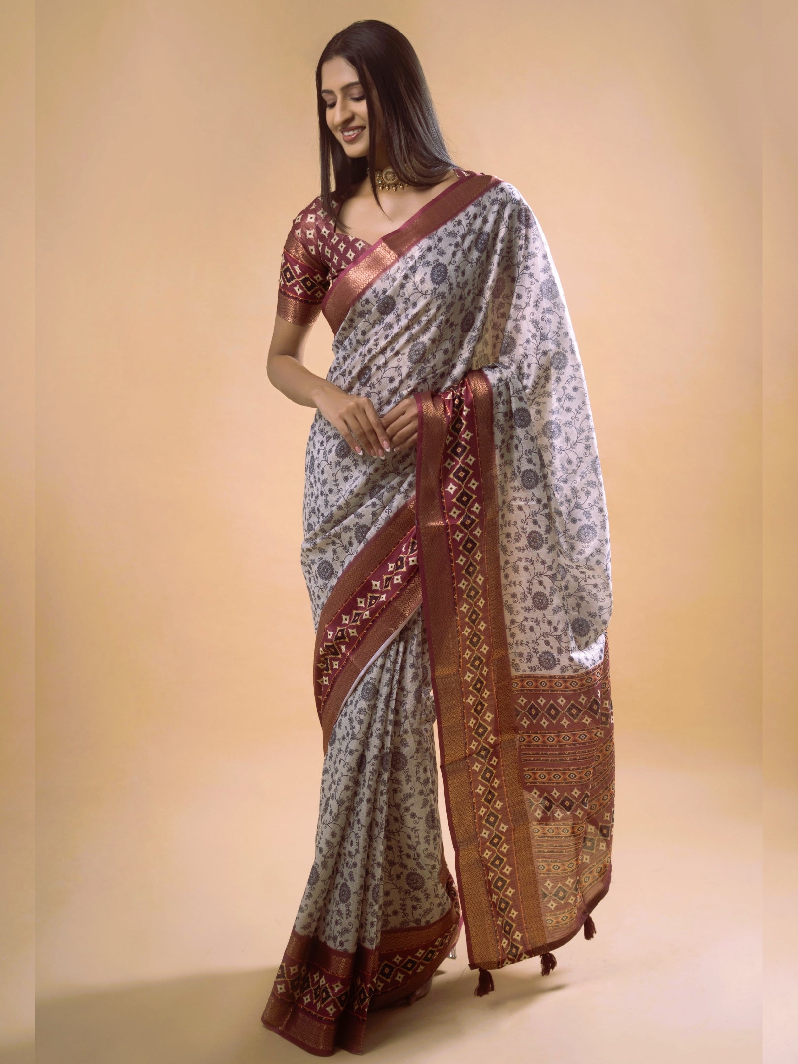 Cream Floral Saree with Maroon Geometric Zari Border and Printed Blouse
