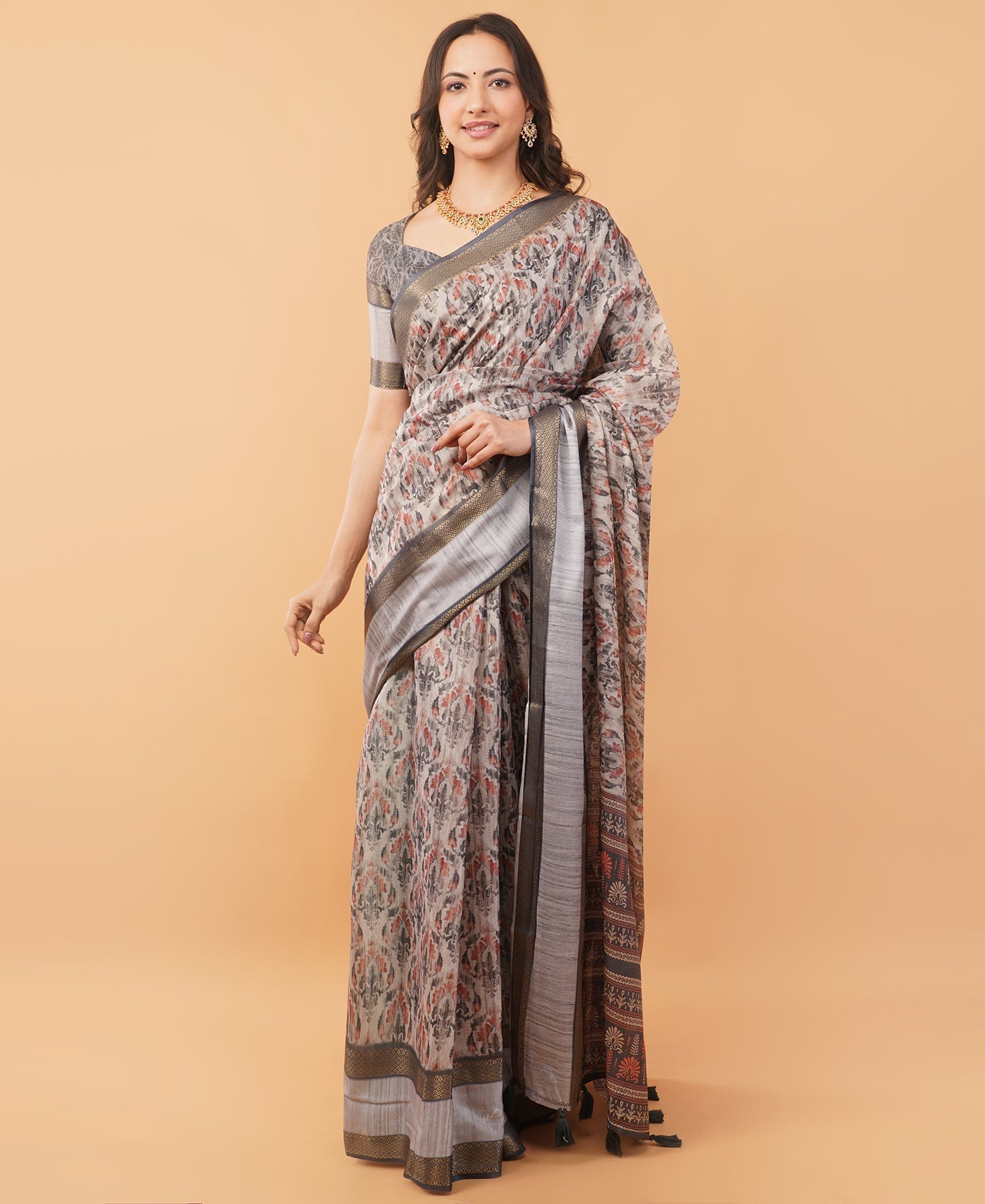 Slate grey and cream abstract floral saree with zari border and tassel pallu