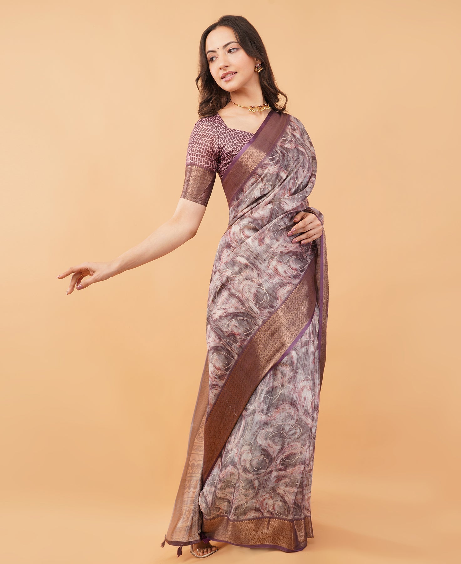 Mauve marble print saree with antique gold zari border and tassel pallu