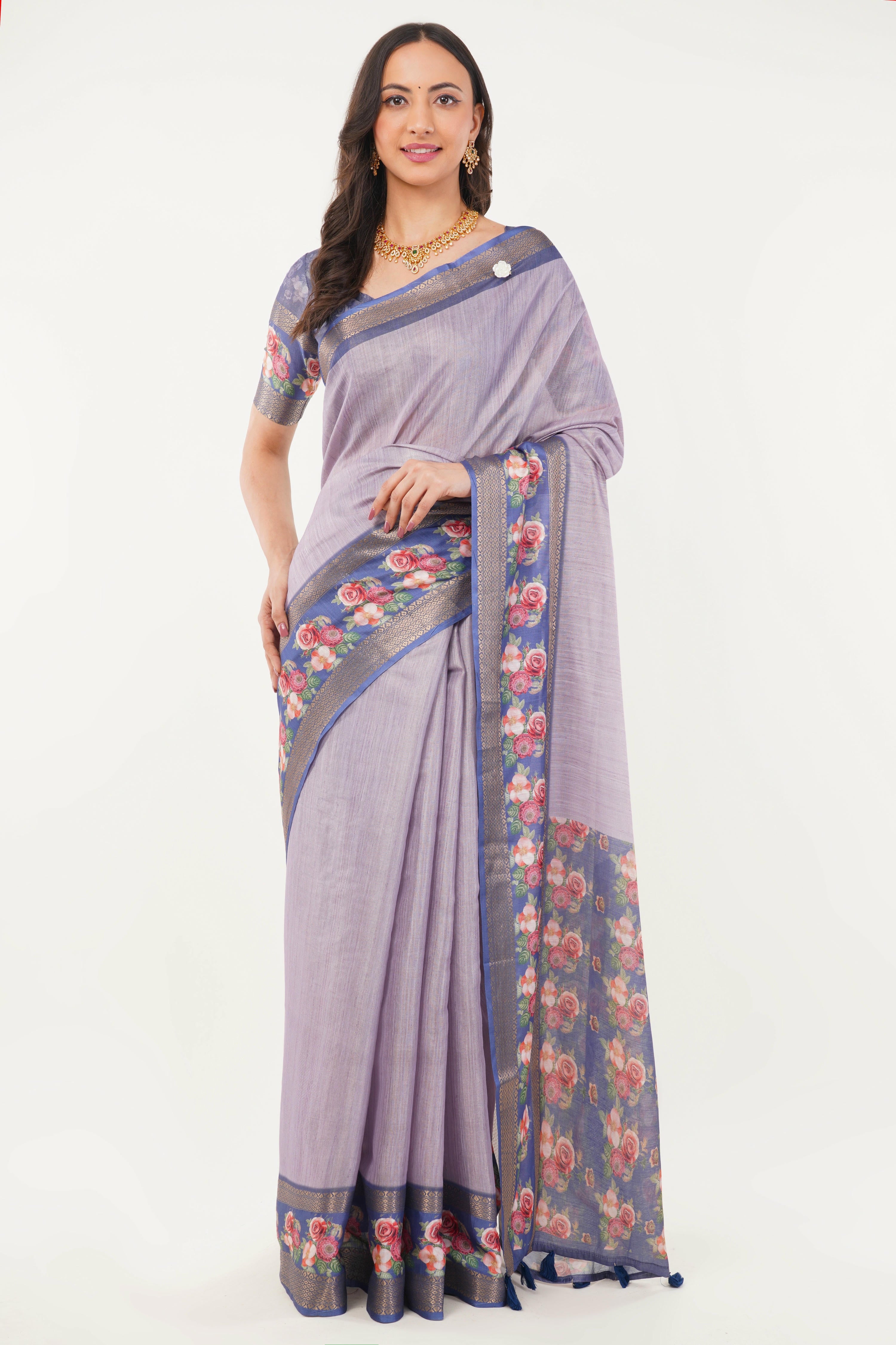 Lilac textured saree with royal blue floral border, zari detailing and ruched blouse