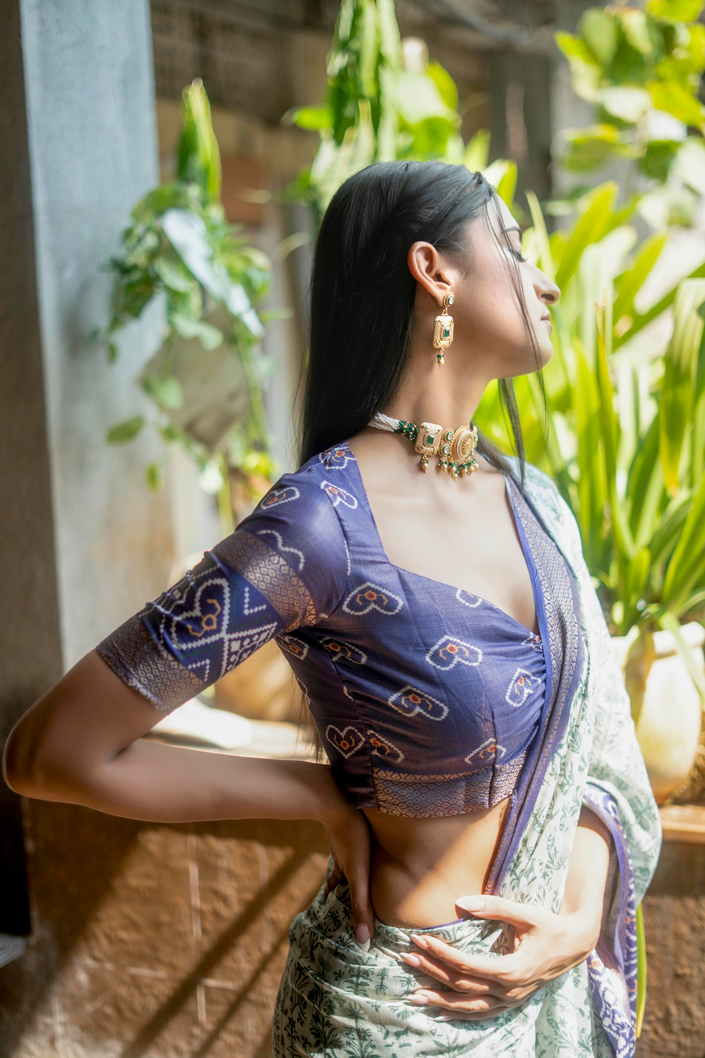 Off-White and Green Floral Saree with Patola-Print Pallu and Ruched Indigo Blouse