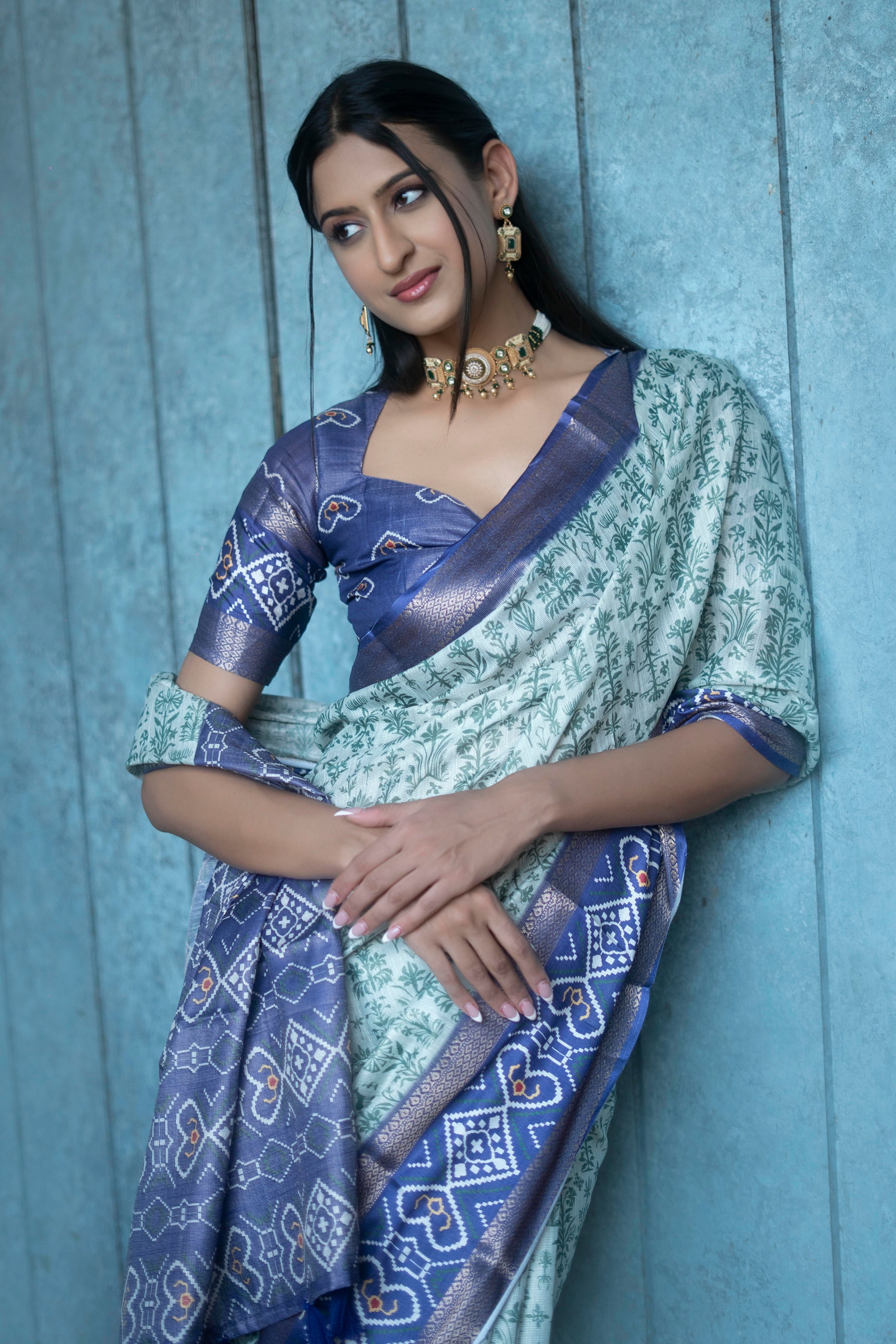 Off-White and Green Floral Saree with Patola-Print Pallu and Ruched Indigo Blouse