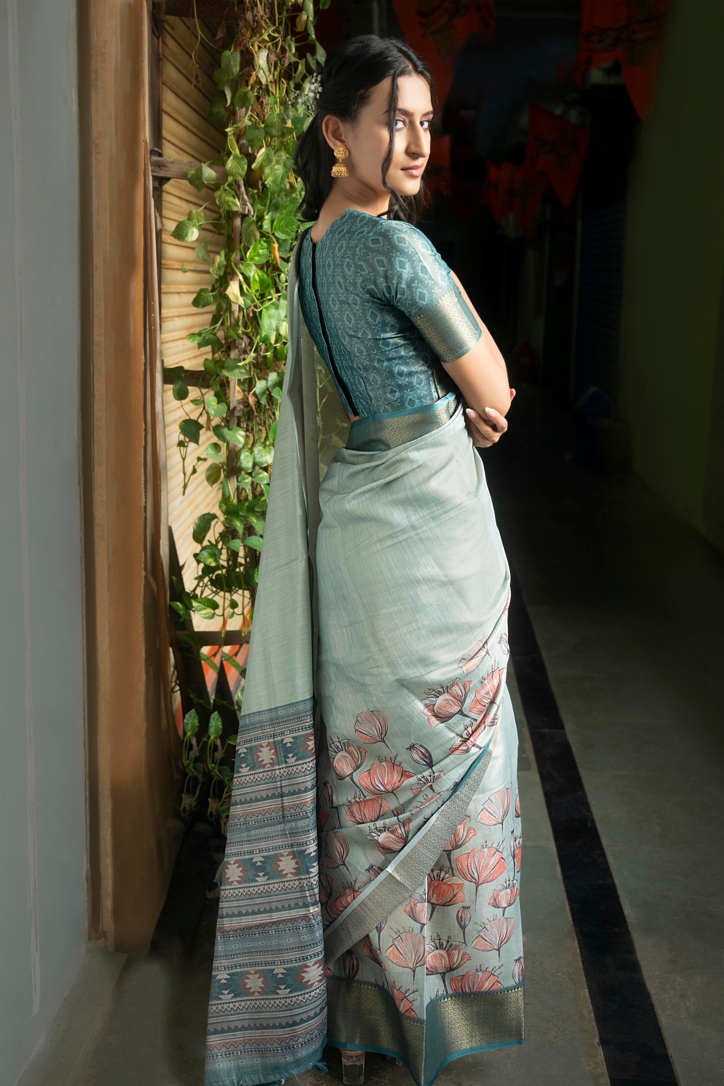 Sage Green Floral Print Saree with Zari Border and Teal Geometric Blouse