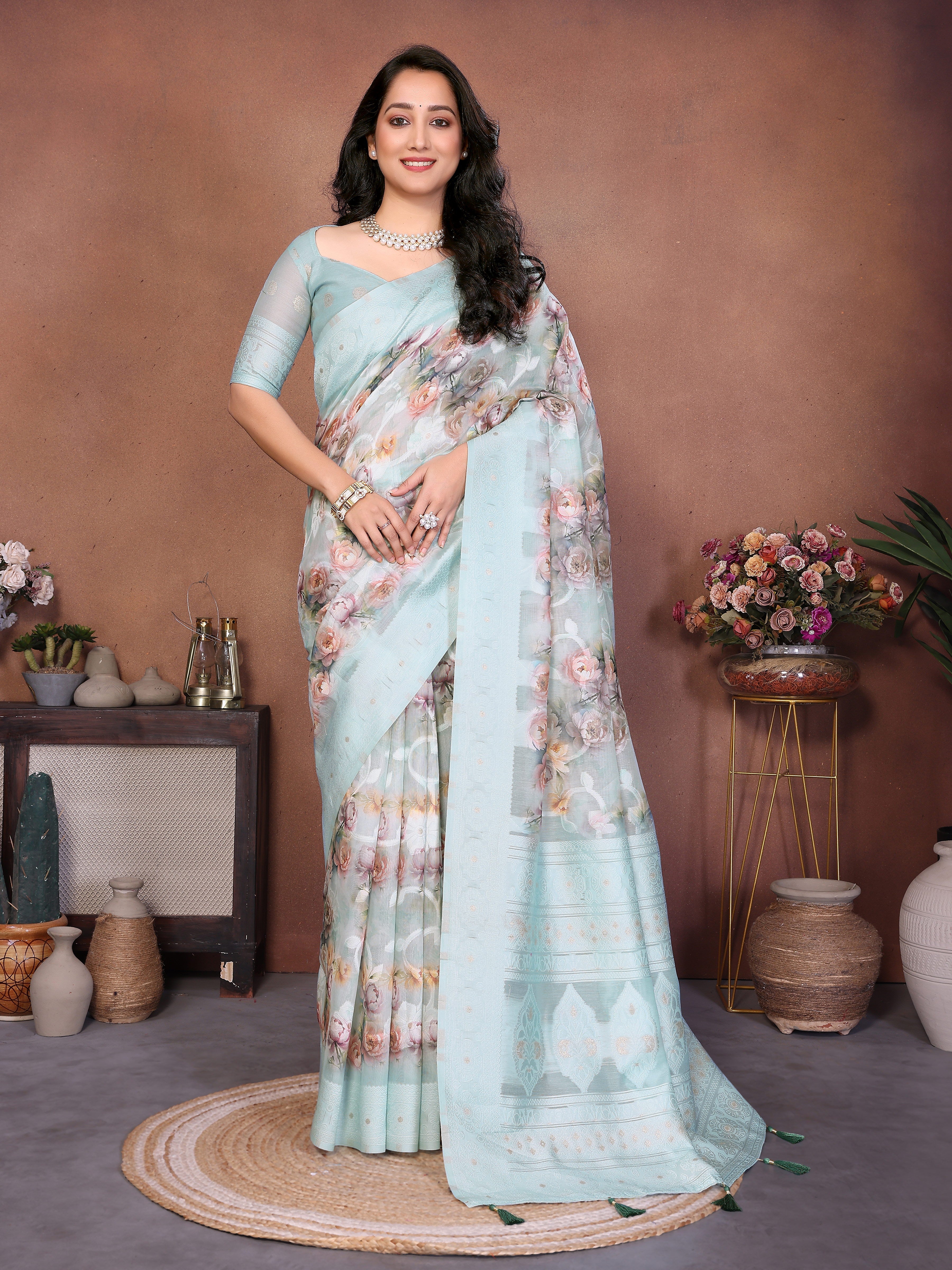 Sea blue semi-sheer floral print saree with champagne gold zari border and woven pallu
