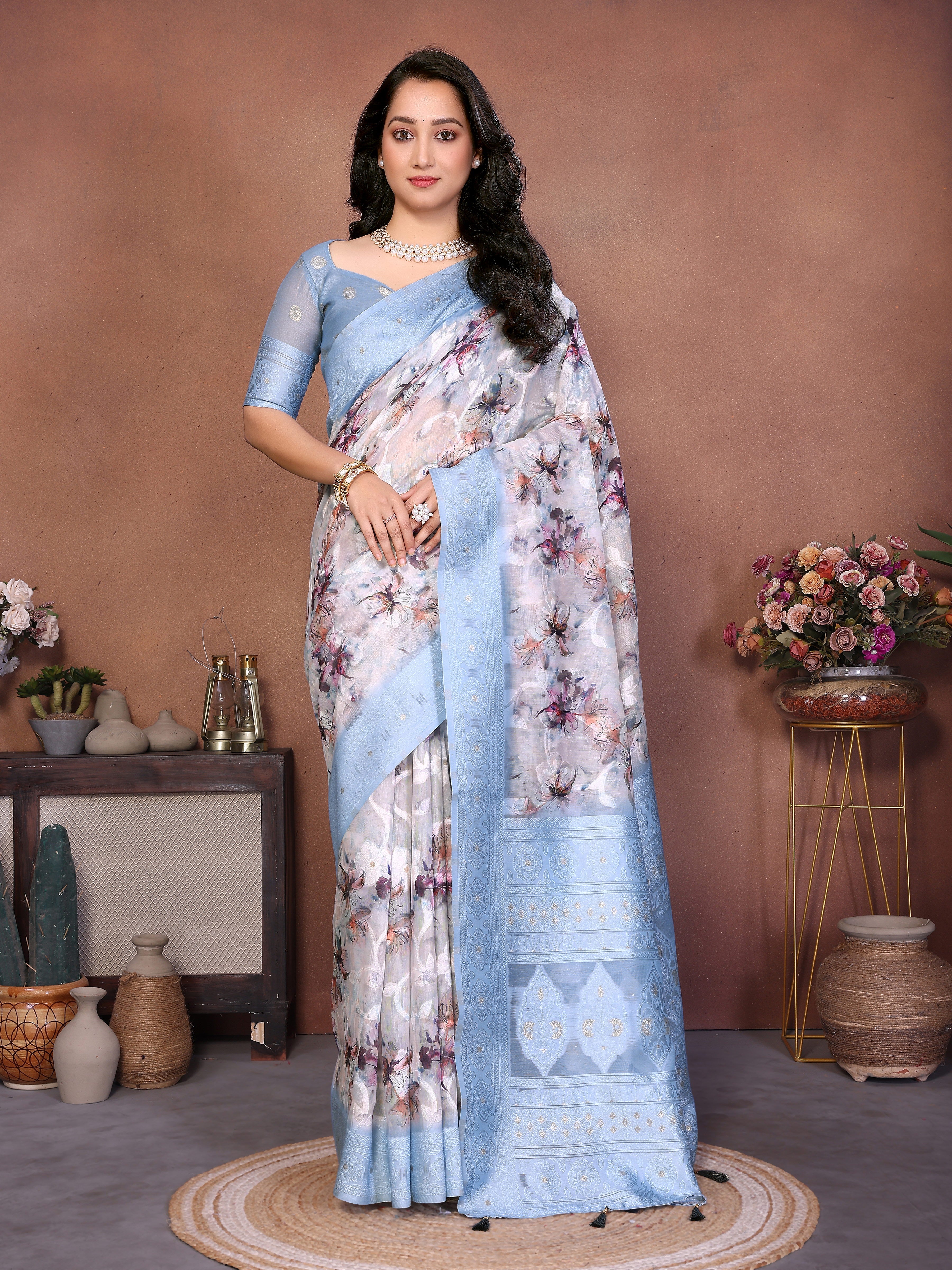 Semi-sheer floral print saree with champagne gold zari border and tassel pallu