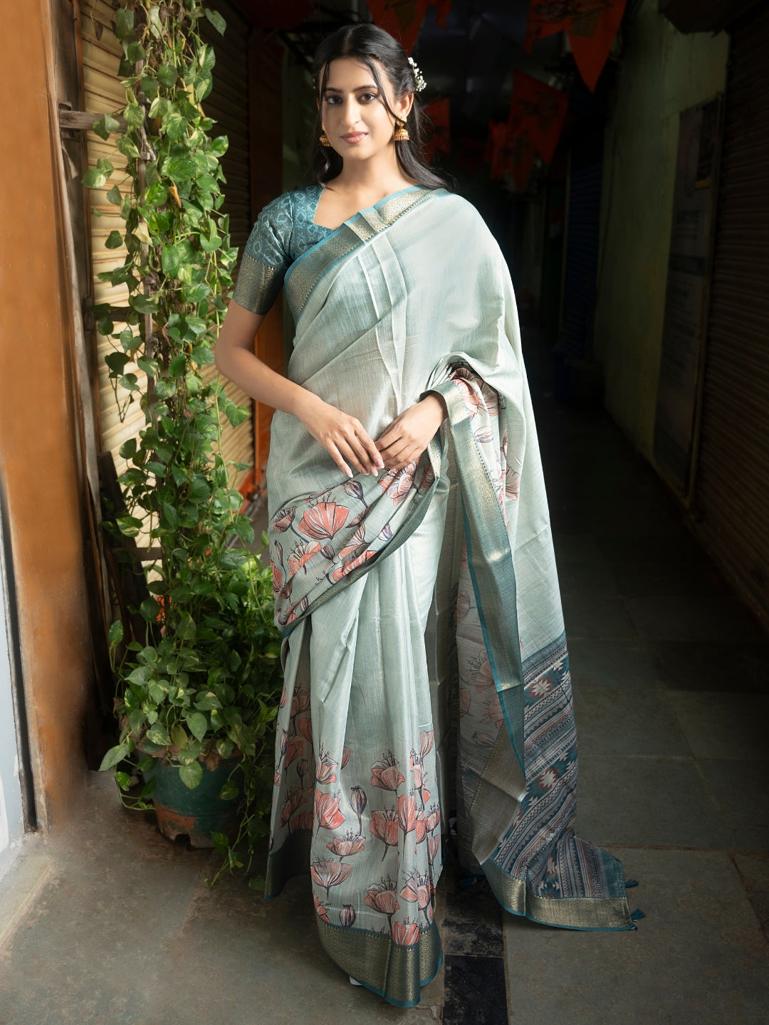 Sage Green Floral Print Saree with Zari Border and Teal Geometric Blouse