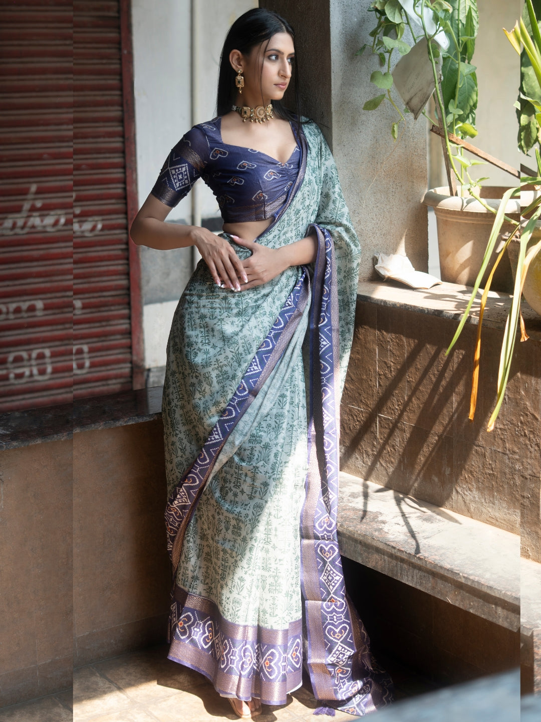 Off-White and Green Floral Saree with Patola-Print Pallu and Ruched Indigo Blouse