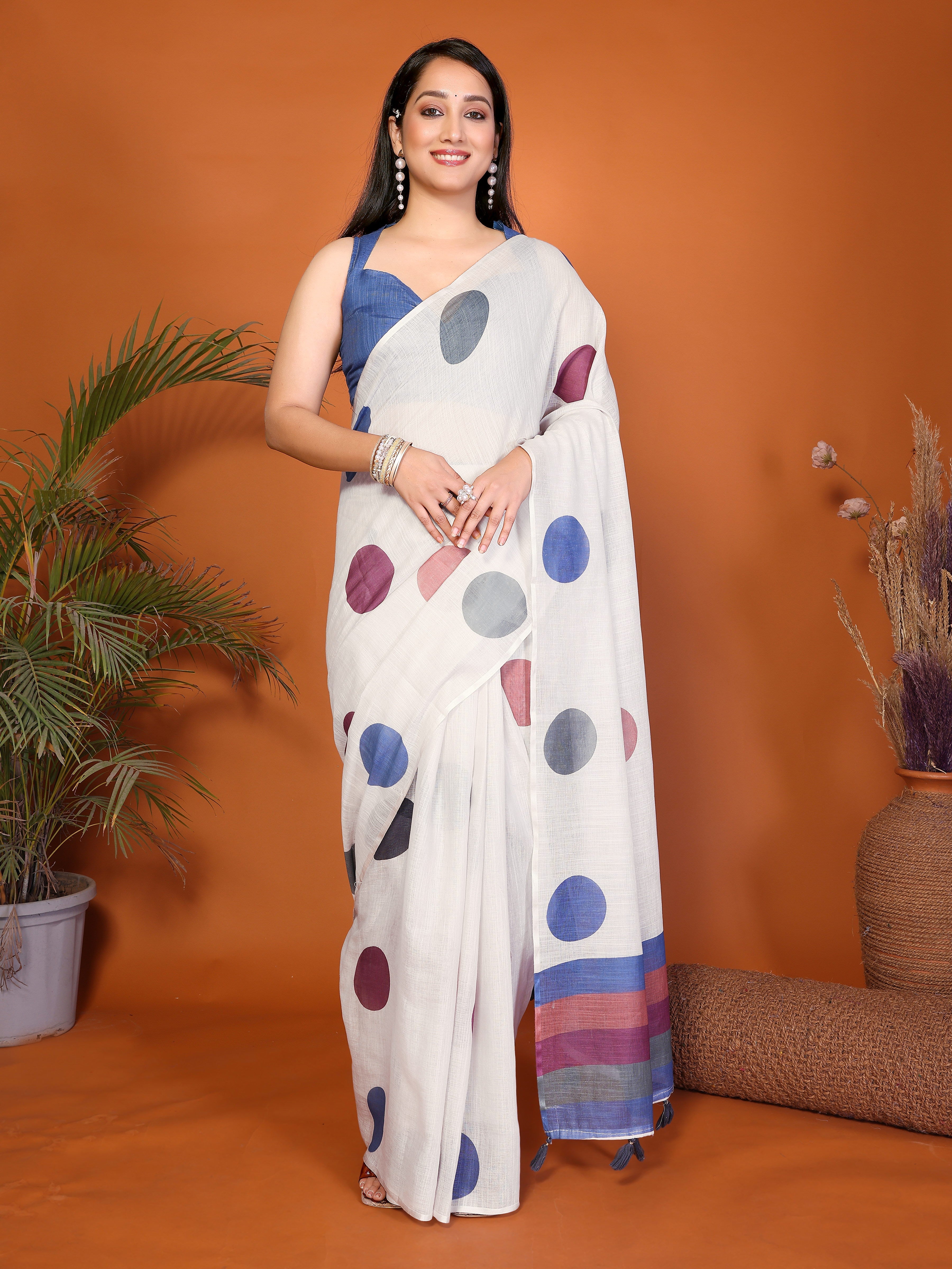 White polka dot ready-to-wear saree with multicolor border, tassels and side pocket