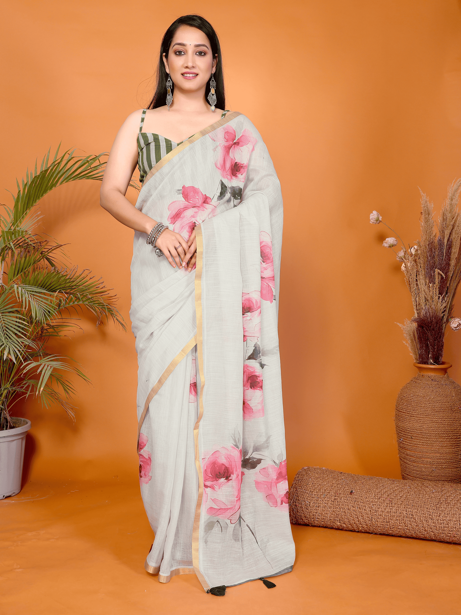 Off-white floral ready-to-wear saree with pink rose print, gold border and pocket