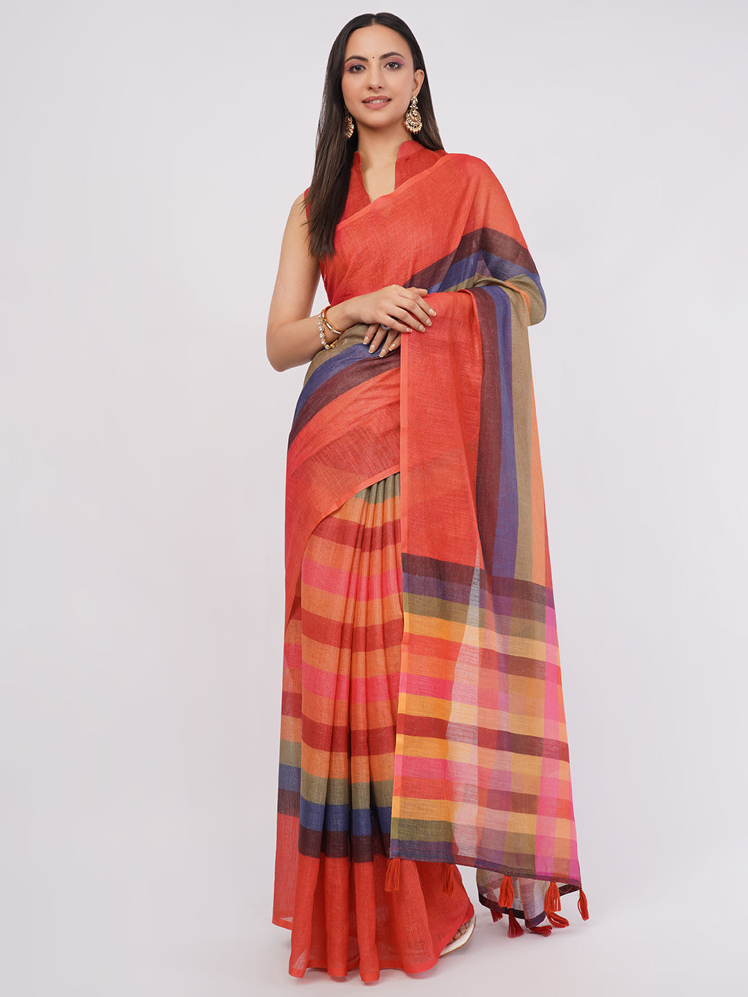 Multicolor horizontal striped linen saree with rust red base draped by woman for artistic office wear by Samantha