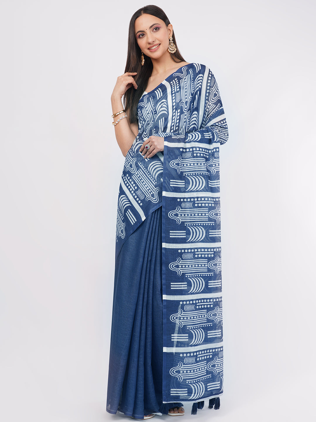 Indigo blue and white geometric printed linen saree with polka dot blouse draped by woman for office wear by Samantha