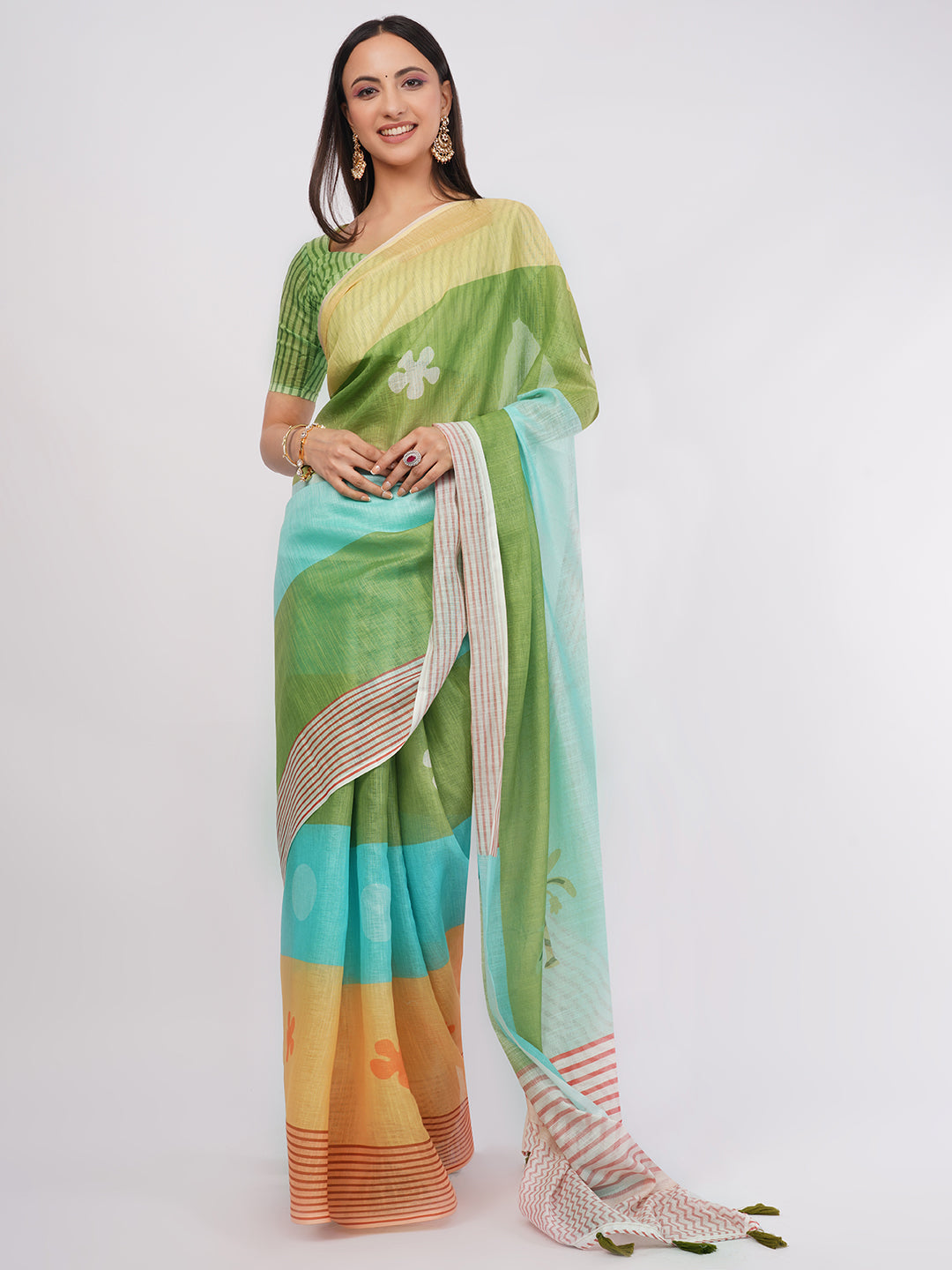 Multicolor tropical green and blue linen saree with nature motifs draped by woman for vacation wear by Samantha