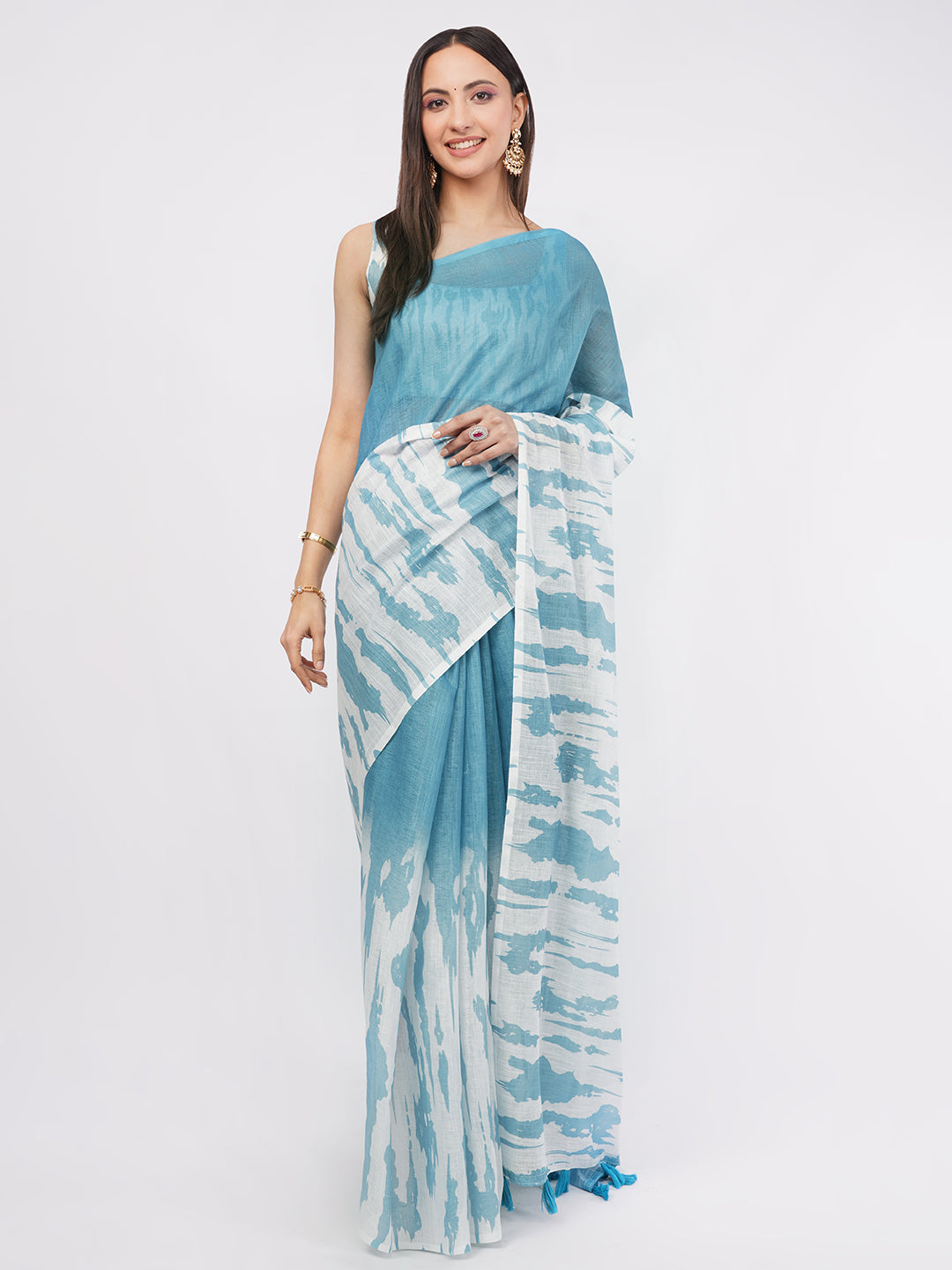 Sky blue and white abstract shibori printed linen saree draped by woman for summer wear by Samantha