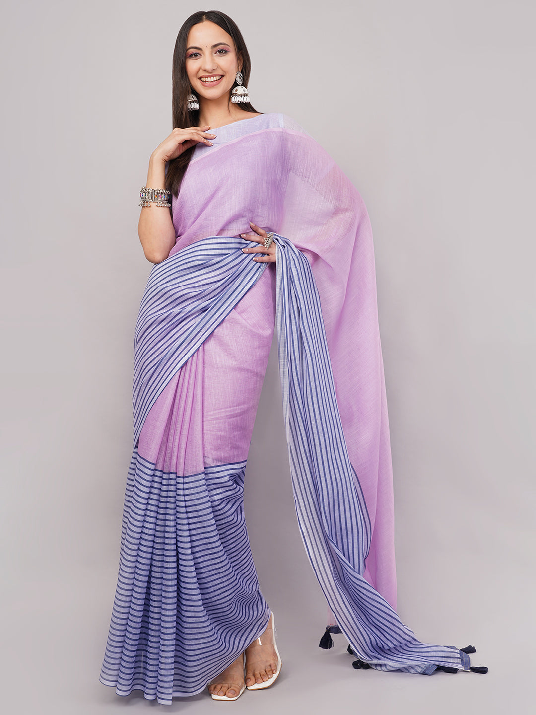 Lavender and blue striped linen saree draped by woman for pastel summer wear by Samantha