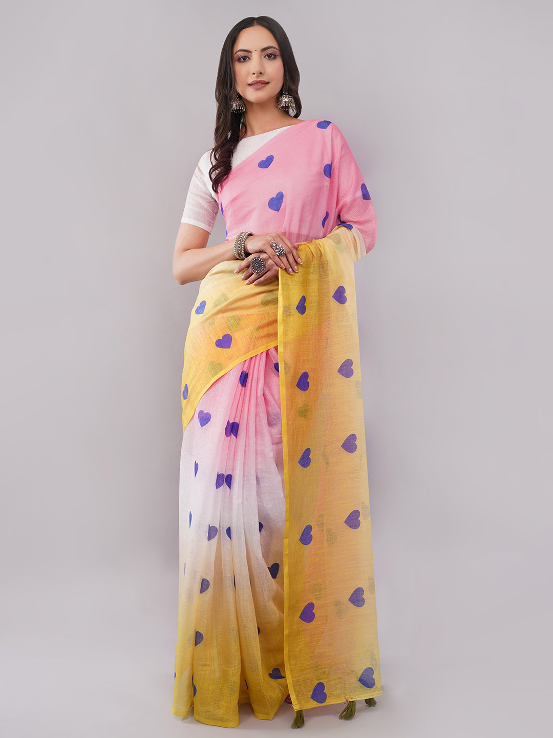Pink and yellow ombre linen saree with blue heart print draped by woman for funky summer wear by Samantha