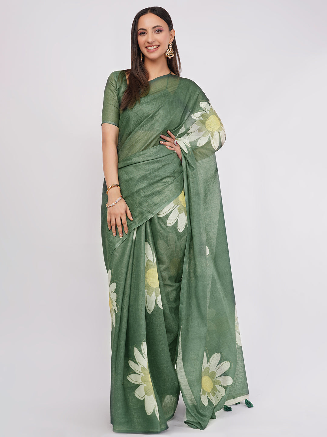 Forest green linen saree with white floral print draped by woman for nature inspired wear by Samantha