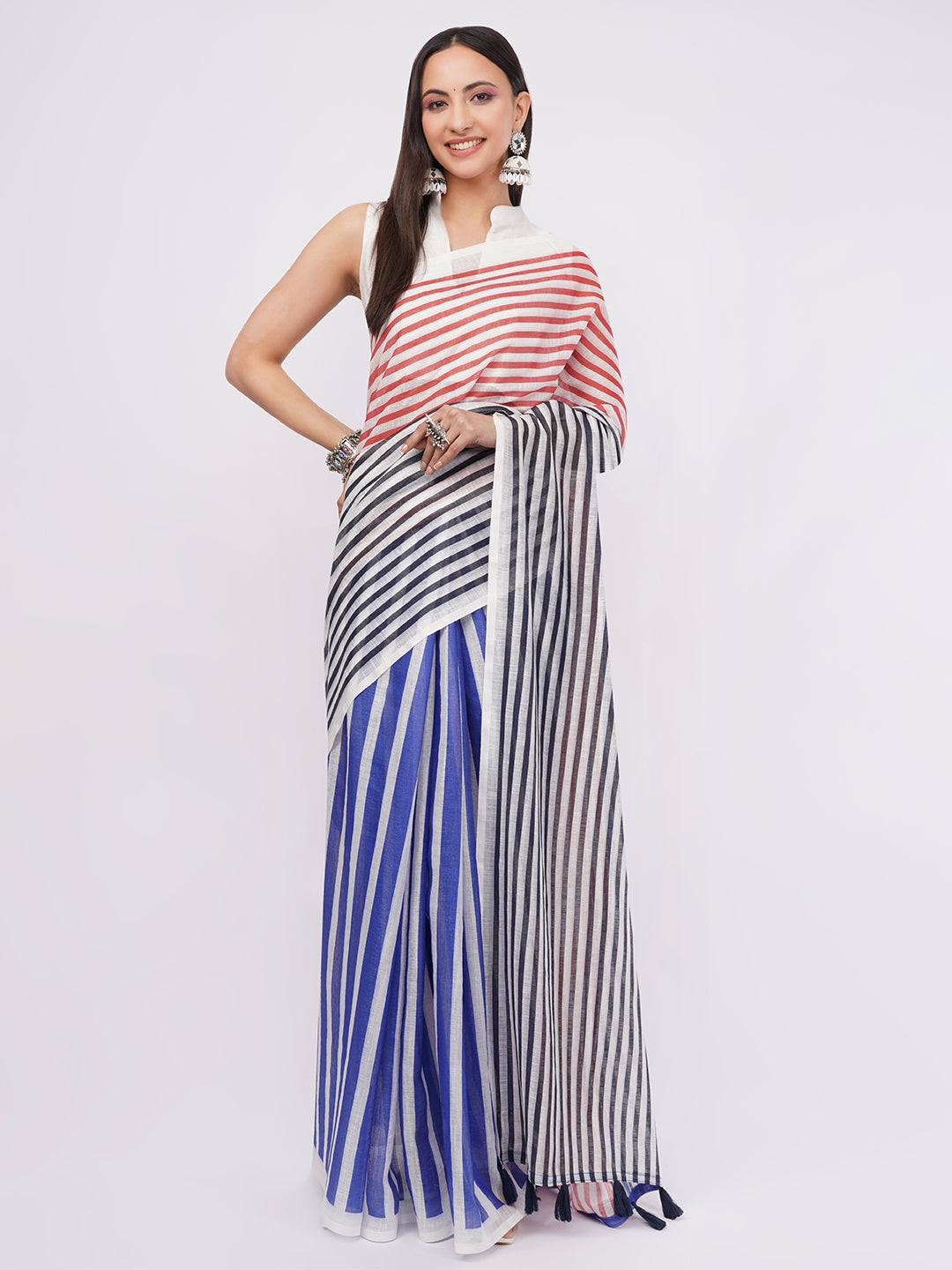 Red white and blue tricolor striped linen saree draped by woman for nautical office wear by Samantha