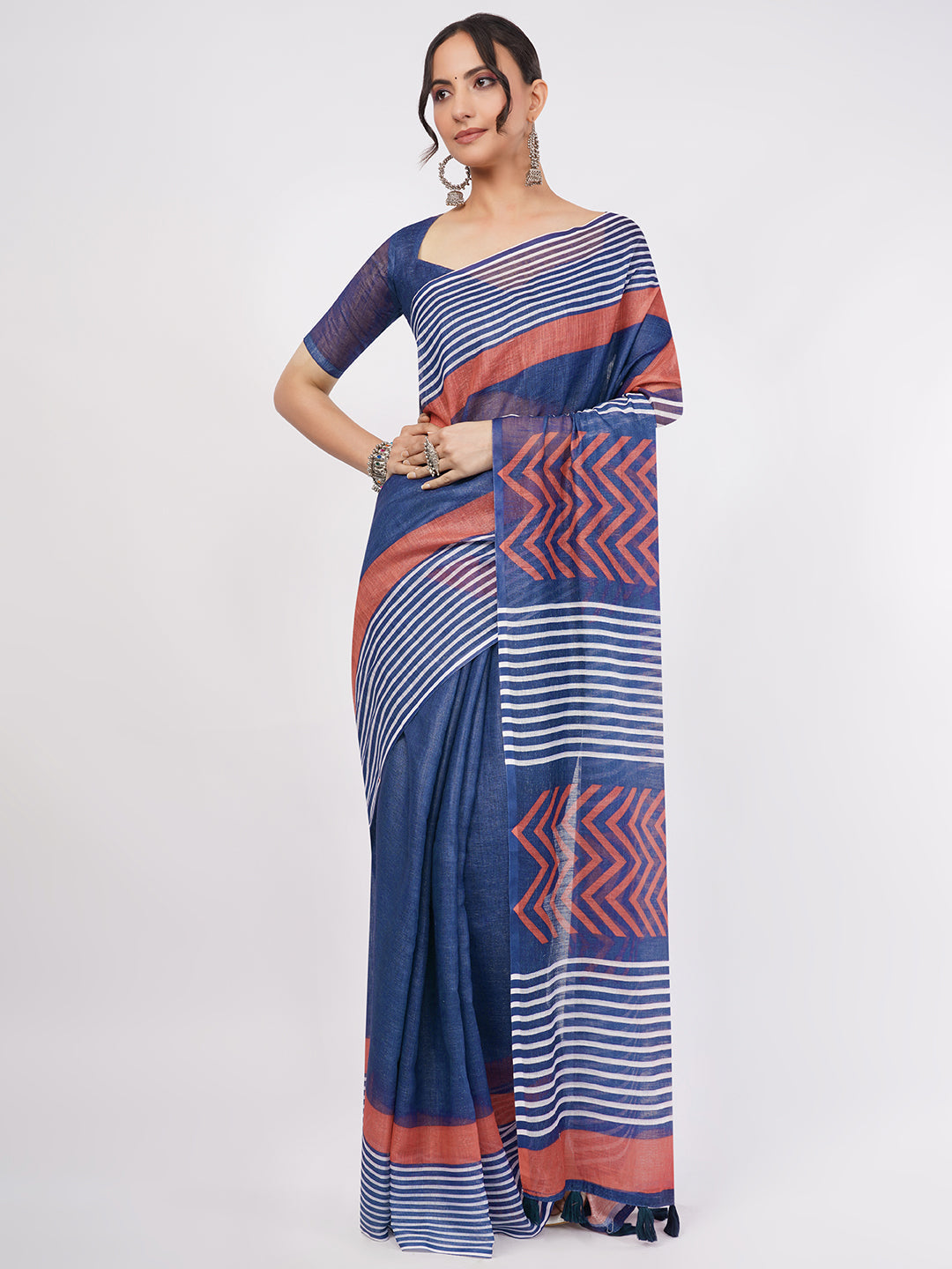 Indigo blue and rust red geometric striped linen saree draped by woman for modern office wear by Samantha