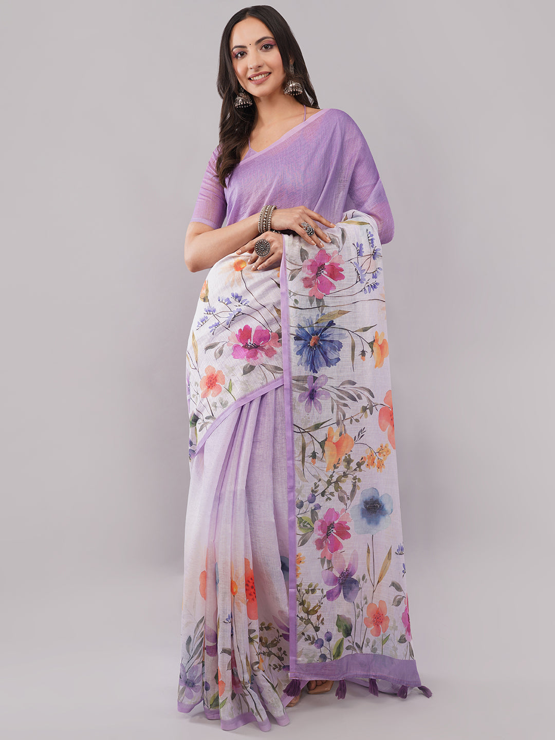 Lavender purple and white linen saree with multicolor floral digital print draped by woman for summer garden wear by Samantha