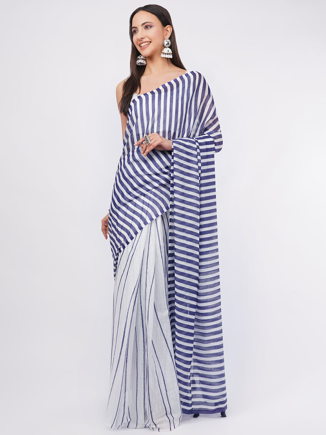Navy blue and white striped linen saree with white blouse draped by woman for nautical office wear by Samantha