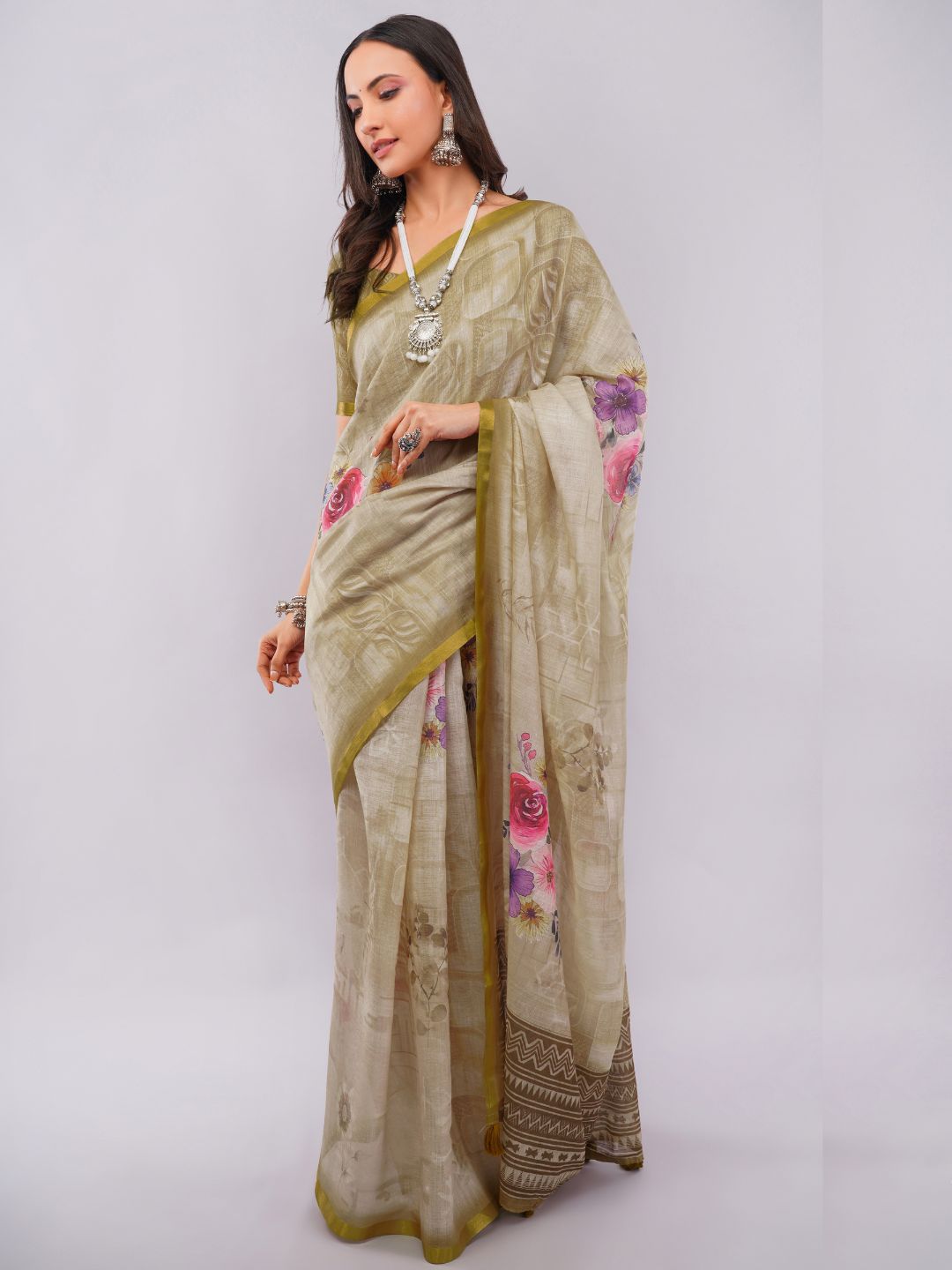 Beige linen saree with vintage floral print and olive green blouse draped by woman for office wear by Samantha