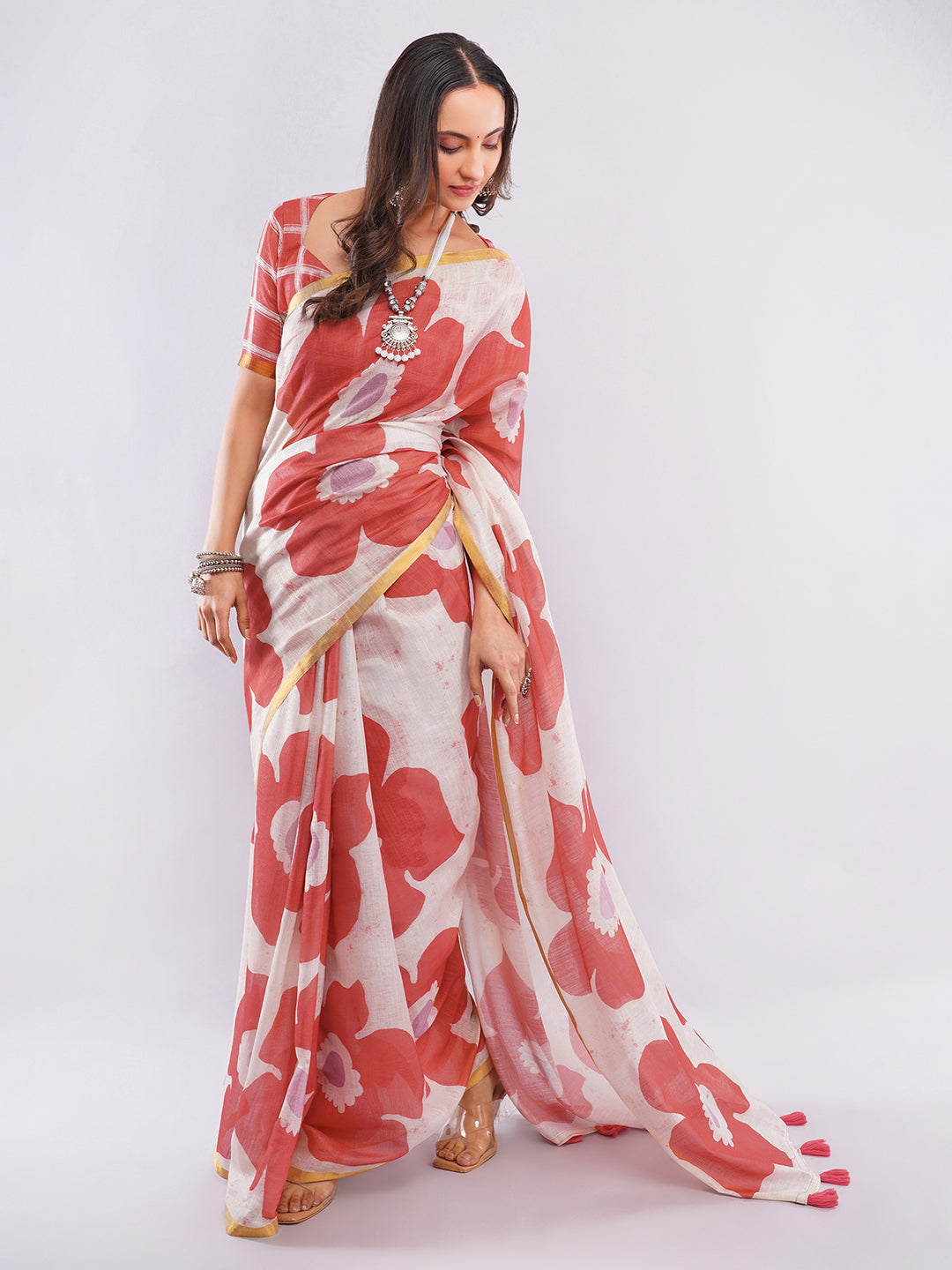 Red and peach ombre linen saree with tropical leaf print draped by woman for summer wear by Samantha