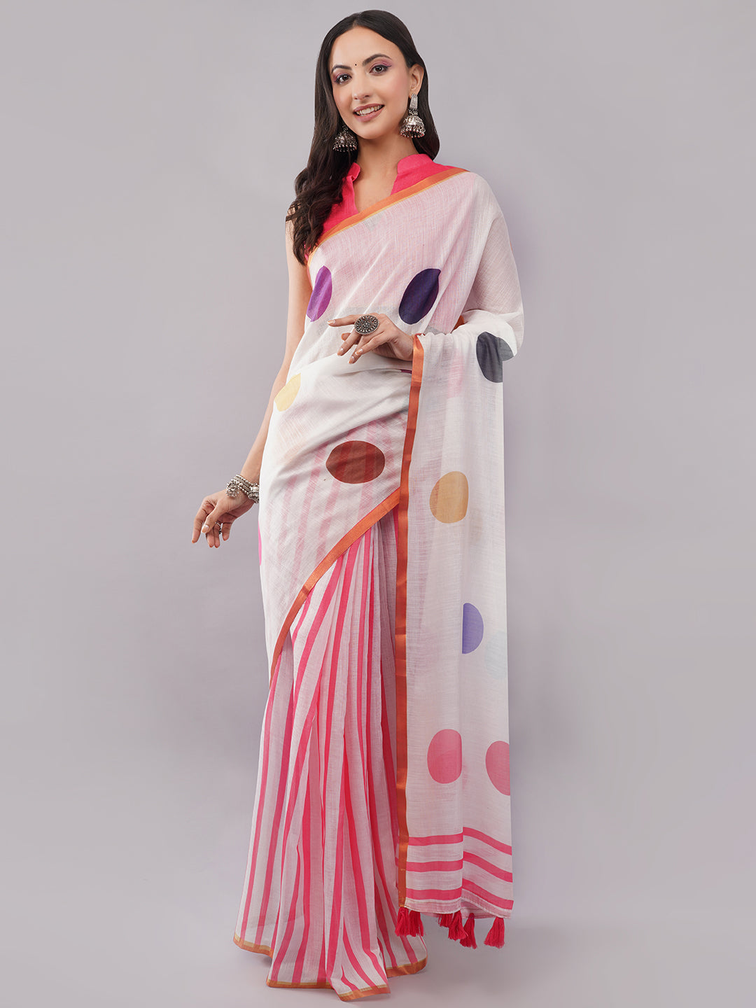 White and pink polka dot linen saree with striped pleats draped by woman for retro pop-art wear by Samantha