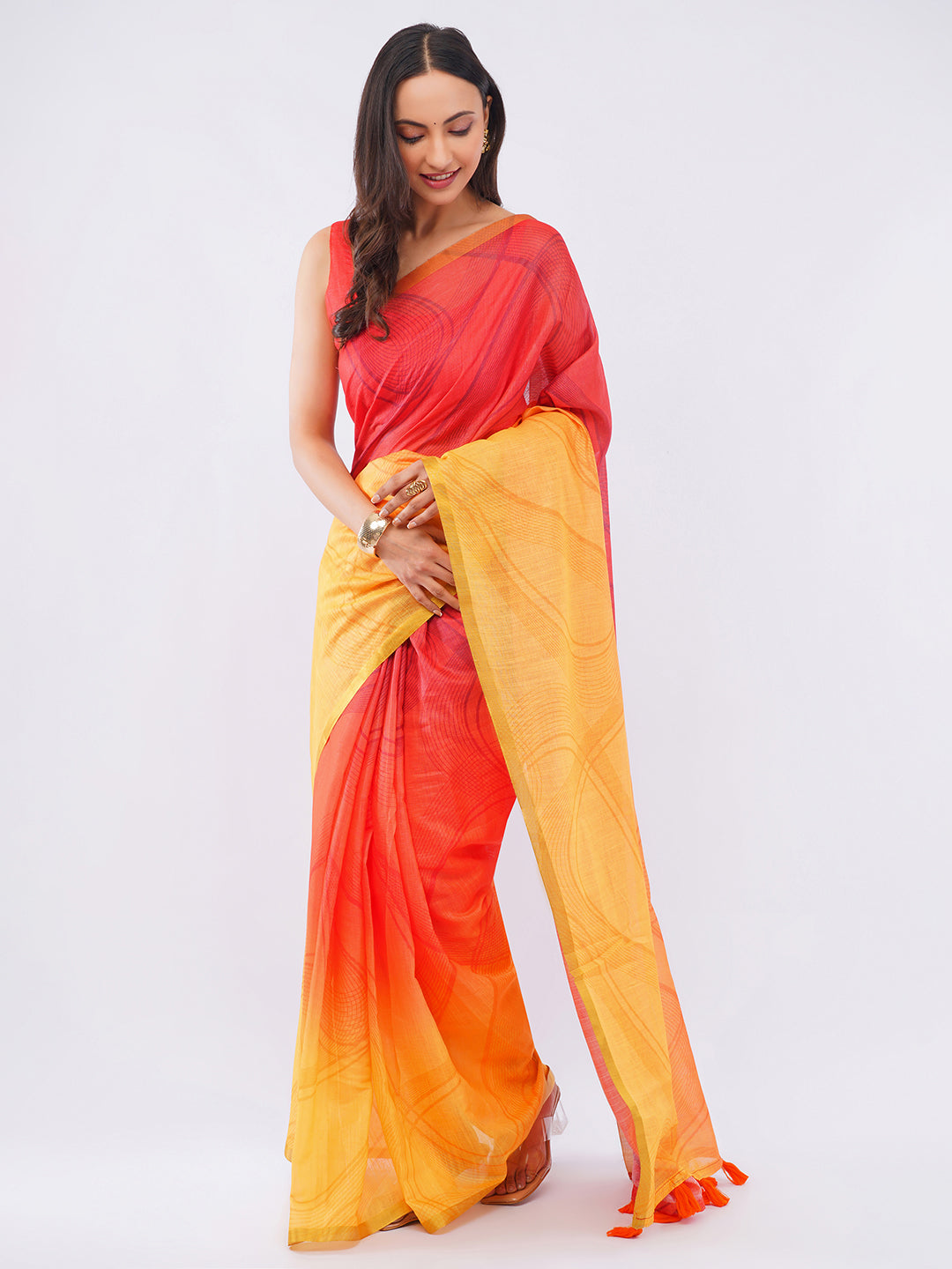 Red and honey yellow ombre linen saree with sunset gradient draped by woman for festive wear by Samantha