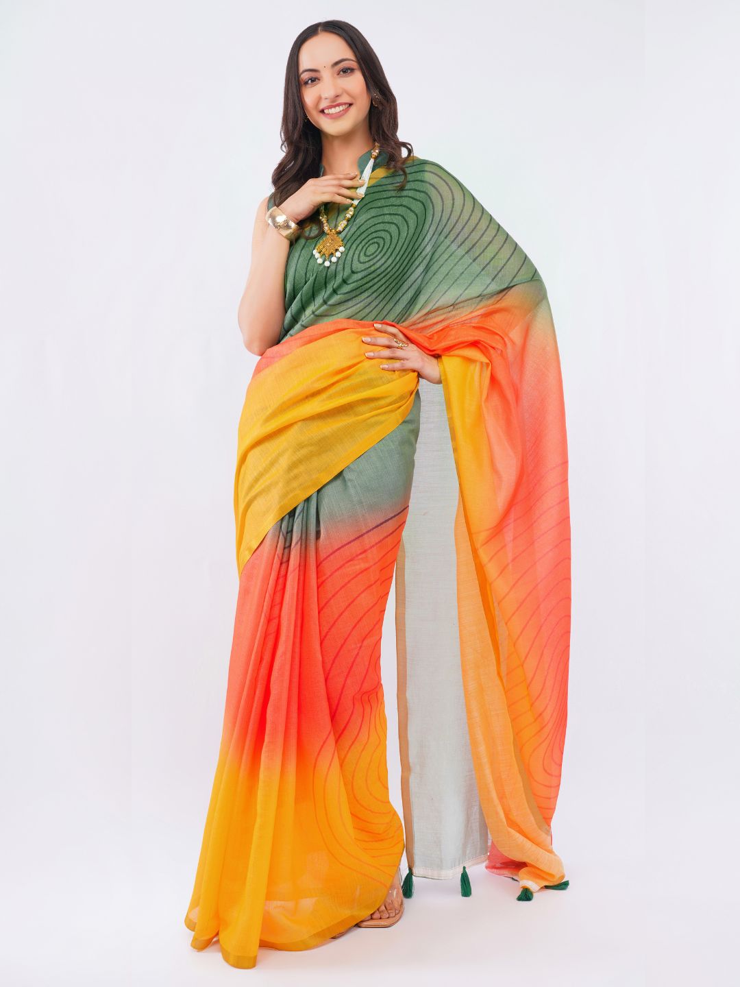 Mehendi green and mustard yellow ombre linen saree with geometric vortex prints draped by woman for festive wear by Samantha