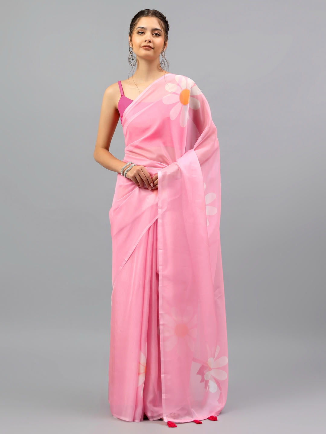 Beautiful woman styled in a sheer magenta pink floral printed chiffon saree by Samantha.