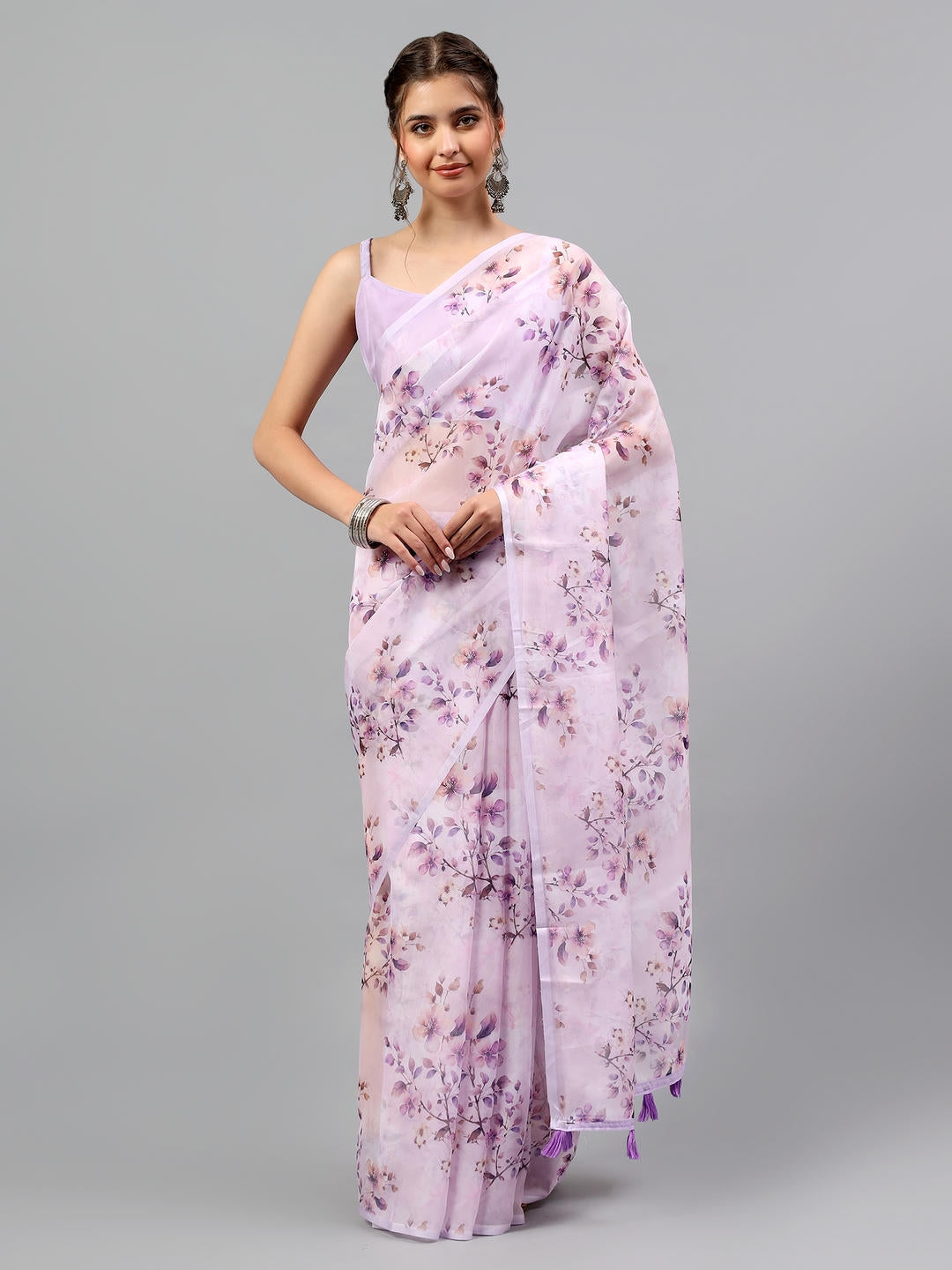 Beautiful woman styled in a sheer lavender lilac floral printed chiffon saree by Samantha.