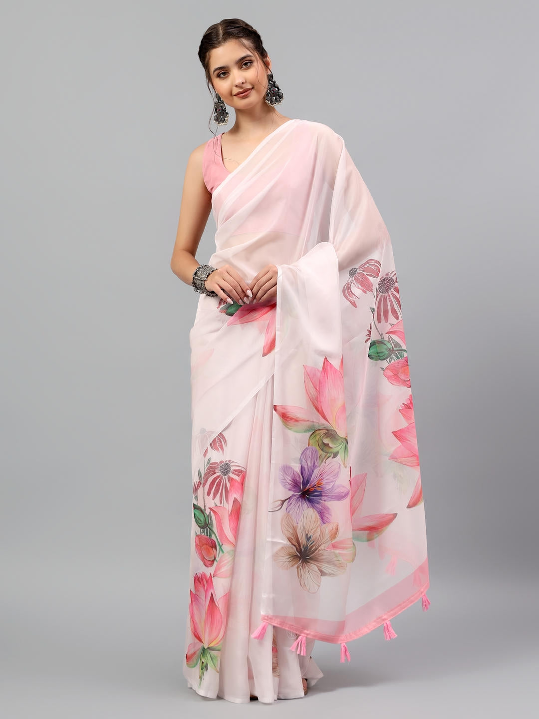 Beautiful woman styled in a sheer blush pink floral printed chiffon saree by Samantha.