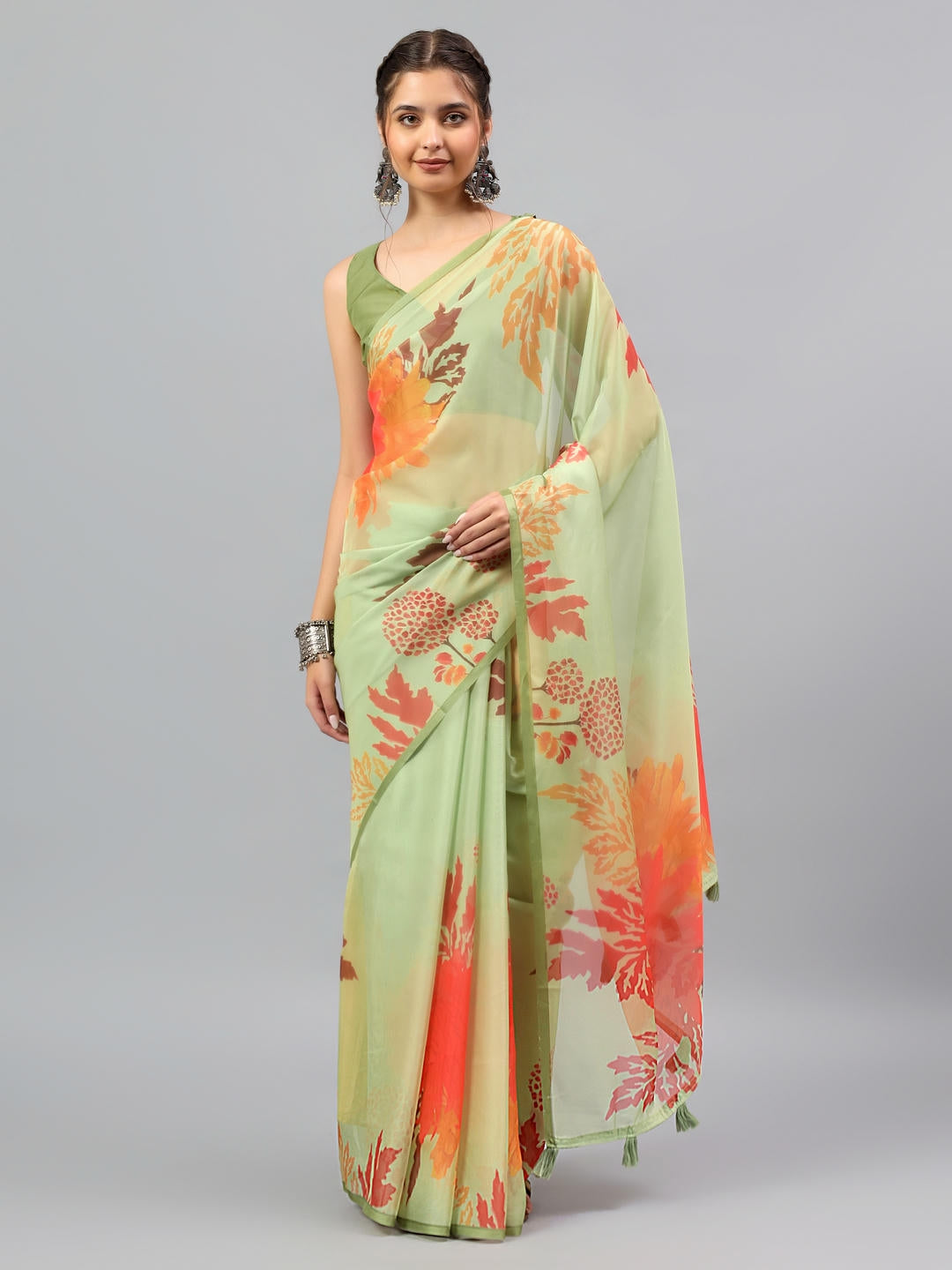 Beautiful woman styled in a sheer mint green spring floral printed chiffon saree by Samantha.