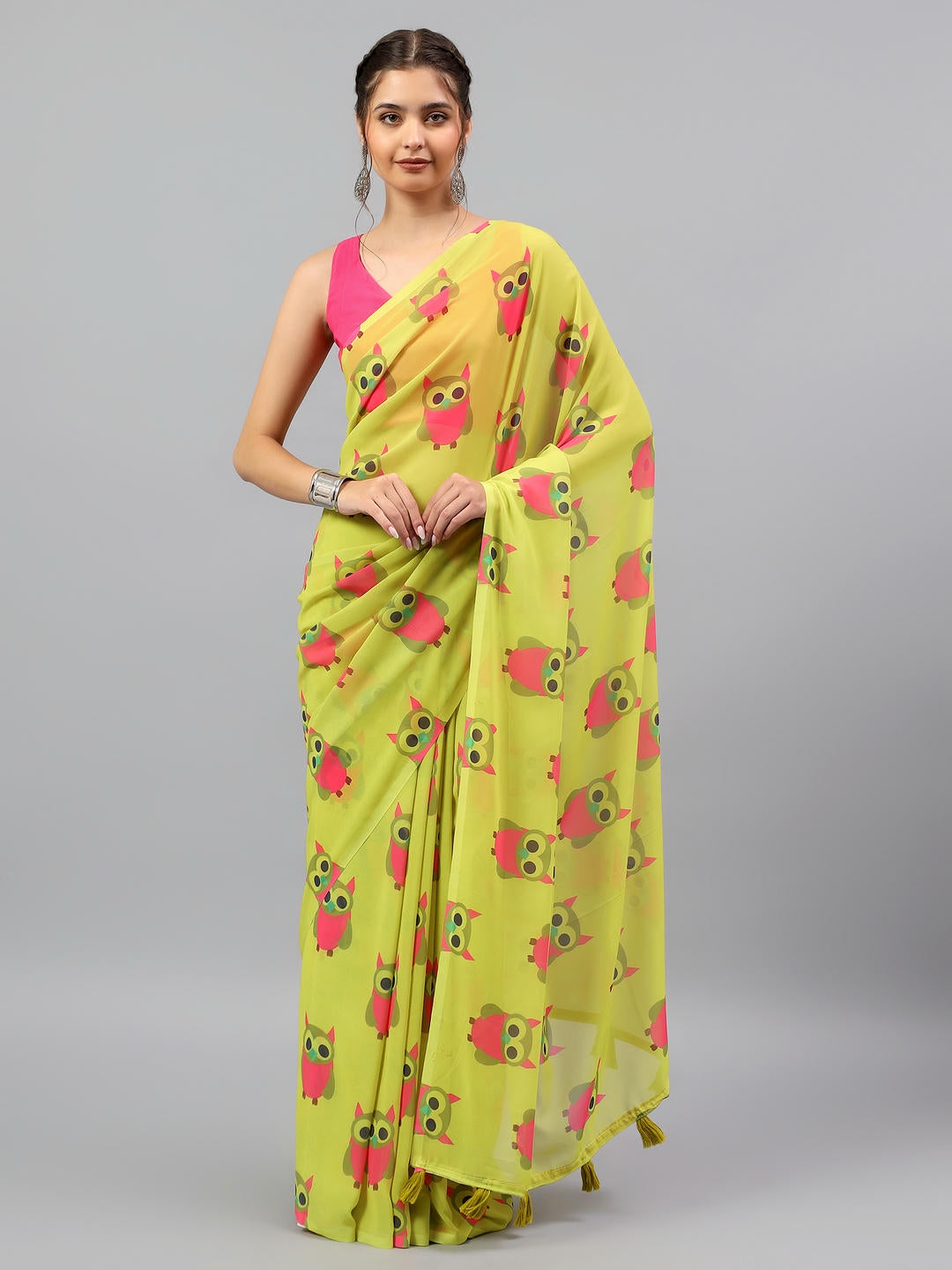 Beautiful woman styled in a fluid lemon green faux georgette ombre saree with an orange contrast blouse by Samantha.