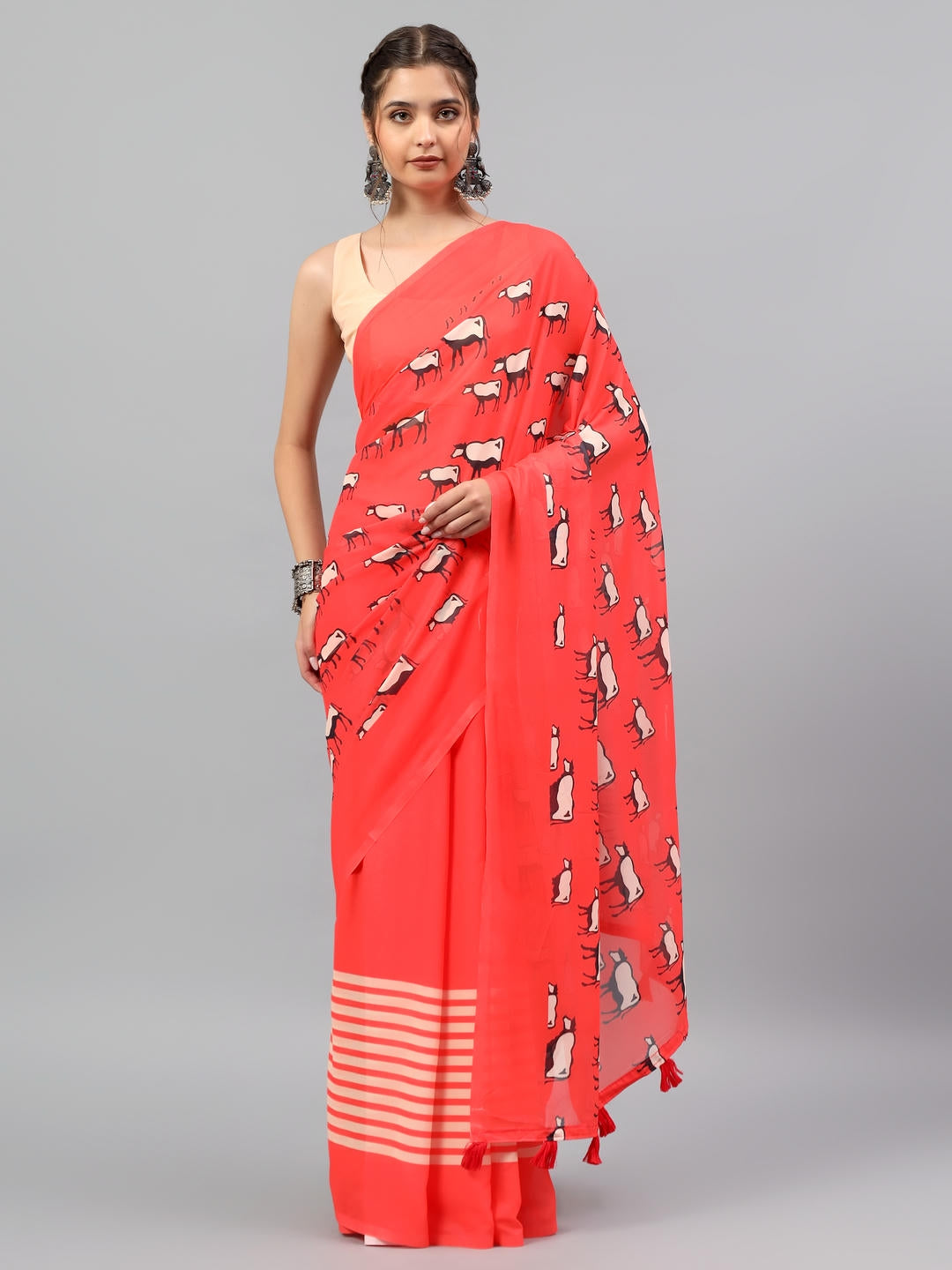 Beautiful woman styled in a classic red faux georgette saree with ethnic geometric prints by Samantha.