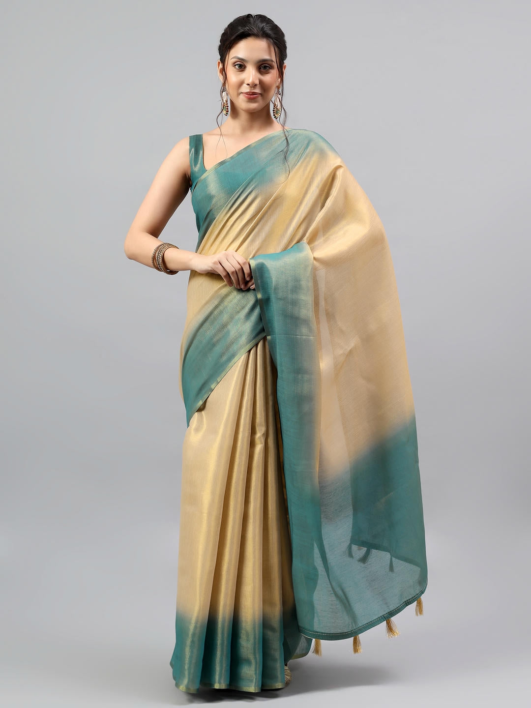 Beautiful woman styled in a magnificent antique rust beige heavy zari woven silk saree by Samantha.