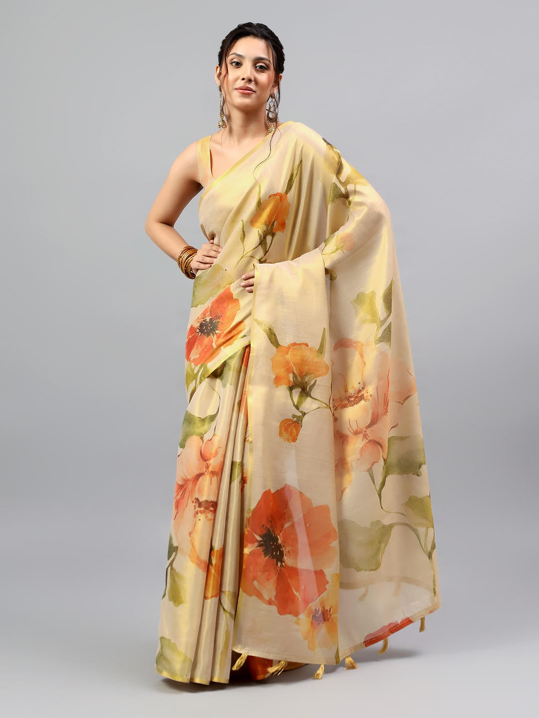 Beautiful woman styled in a magnificent metallic gold heavy zari woven silk saree by Samantha.