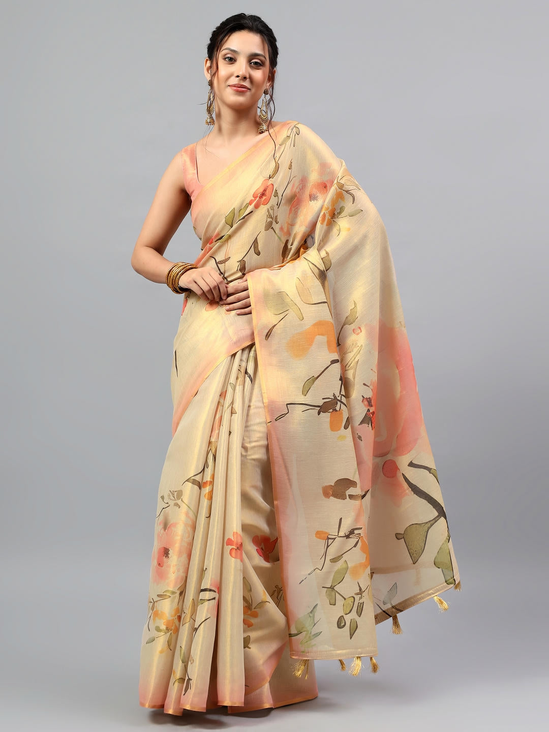 Beautiful woman styled in a majestic golden yellow heavy zari woven silk saree with a contrast pink blouse by Samantha.