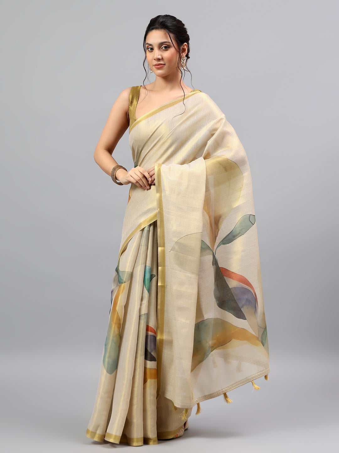 Beautiful woman styled in a majestic cream beige heavy zari woven silk saree with a contrast purple blouse by Samantha.