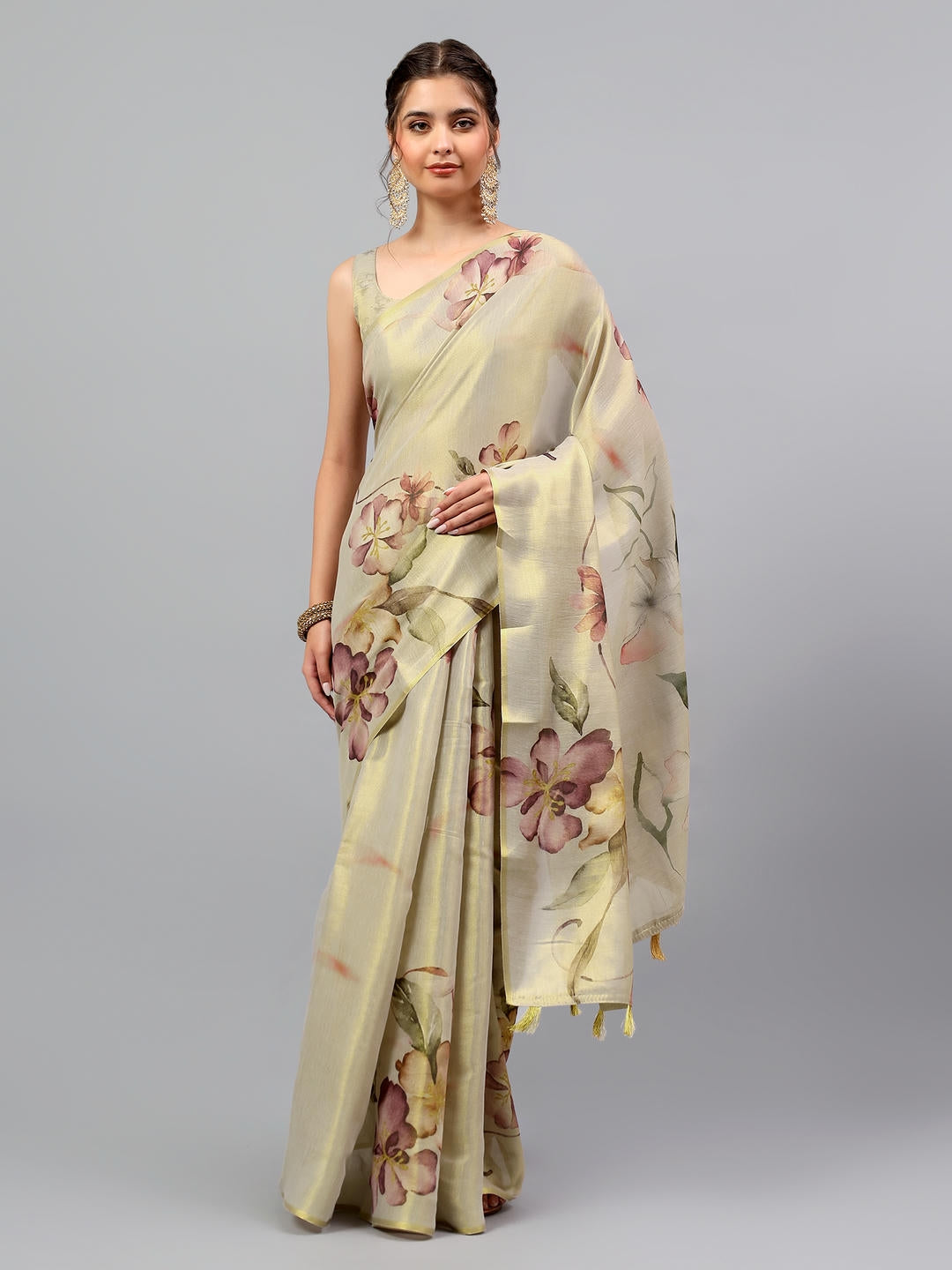 Beautiful woman styled in a classic cream beige heavy zari woven silk saree with an auspicious red contrast blouse by Samantha.