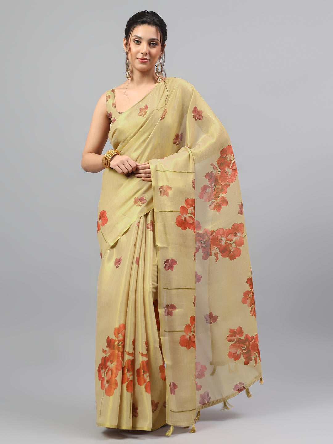 Beautiful woman styled in a majestic gold beige heavy zari woven silk saree with a deep wine contrast blouse by Samantha.