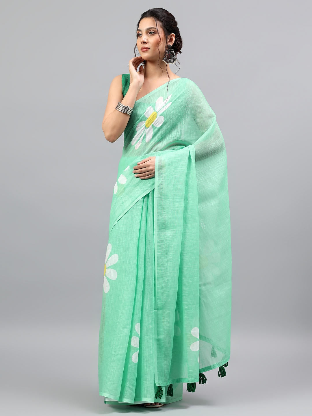Beautiful woman styled in a fresh lemon green linen blend saree with a beige printed blouse by Samantha.