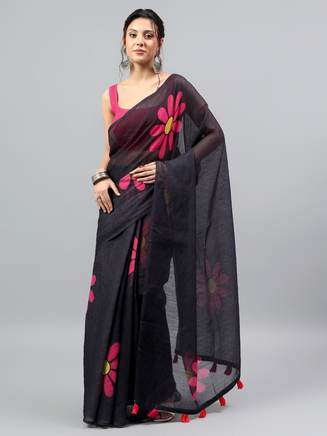 Beautiful woman styled in a professional midnight black slub linen blend saree with a beige printed blouse by Samantha.