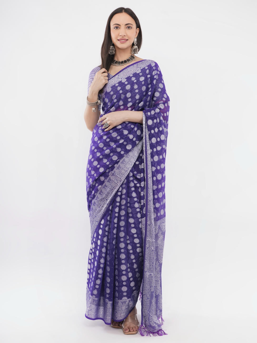Beautiful woman styled in a classic deep purple and white geometric printed georgette saree featuring an abstract design and a matching unstitched blouse by Samantha.