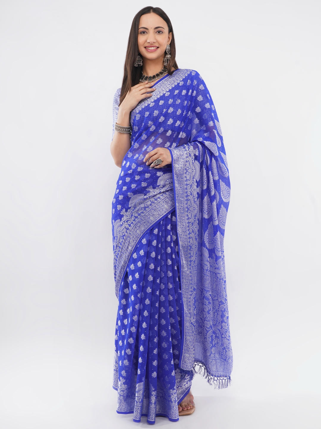 Beautiful woman styled in a classic blue and white geometric printed georgette saree featuring an abstract design and a matching unstitched blouse by Samantha.