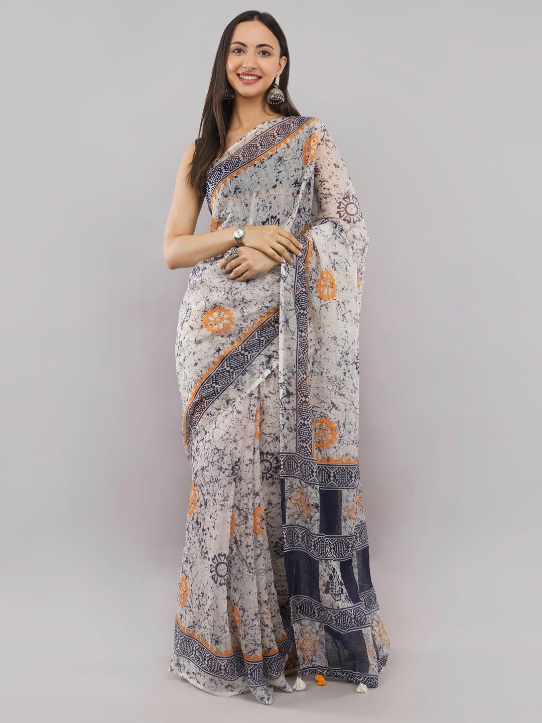 Beautiful woman styled in a classic multicolor floral and geometric printed linen saree featuring a refreshing botanical design and a matching unstitched blouse by Samantha.
