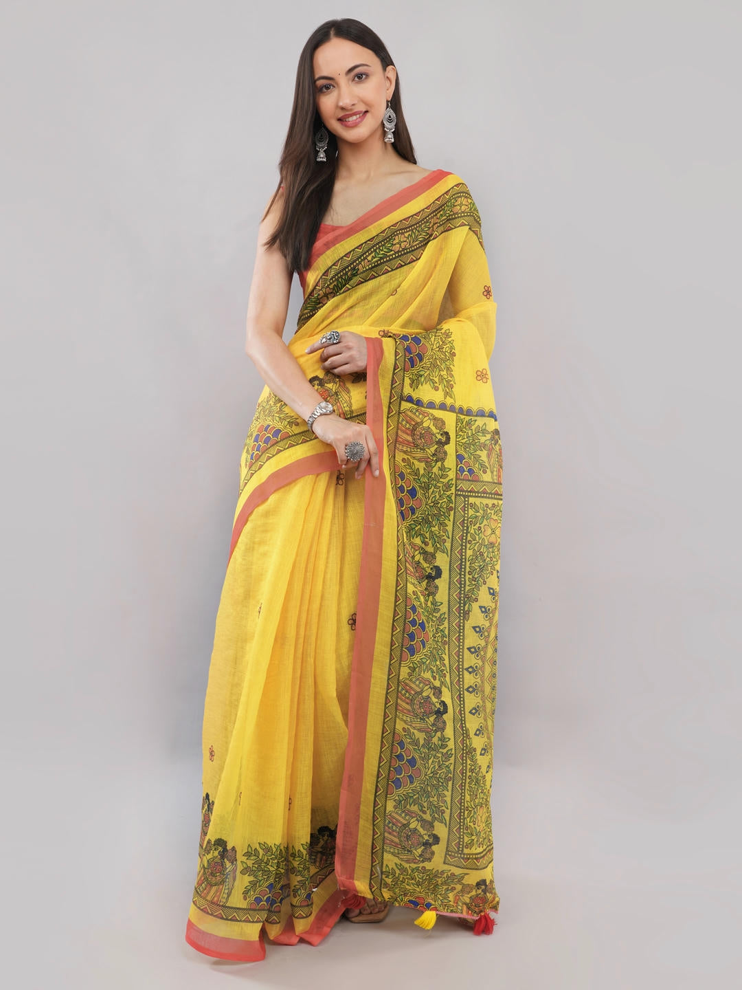 Beautiful woman styled in a classic off white linen saree featuring vibrant yellow floral prints, a geometric border, and a matching unstitched blouse by Samantha.
