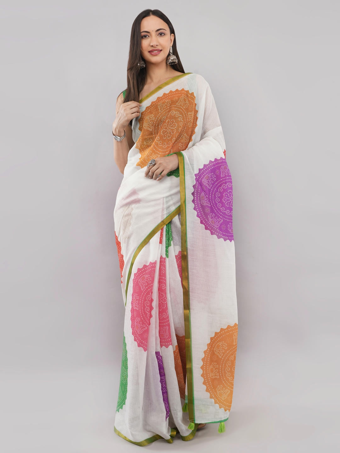 Beautiful woman styled in a classic off white linen saree featuring bold purple floral prints, a geometric border, and a matching unstitched blouse by Samantha.